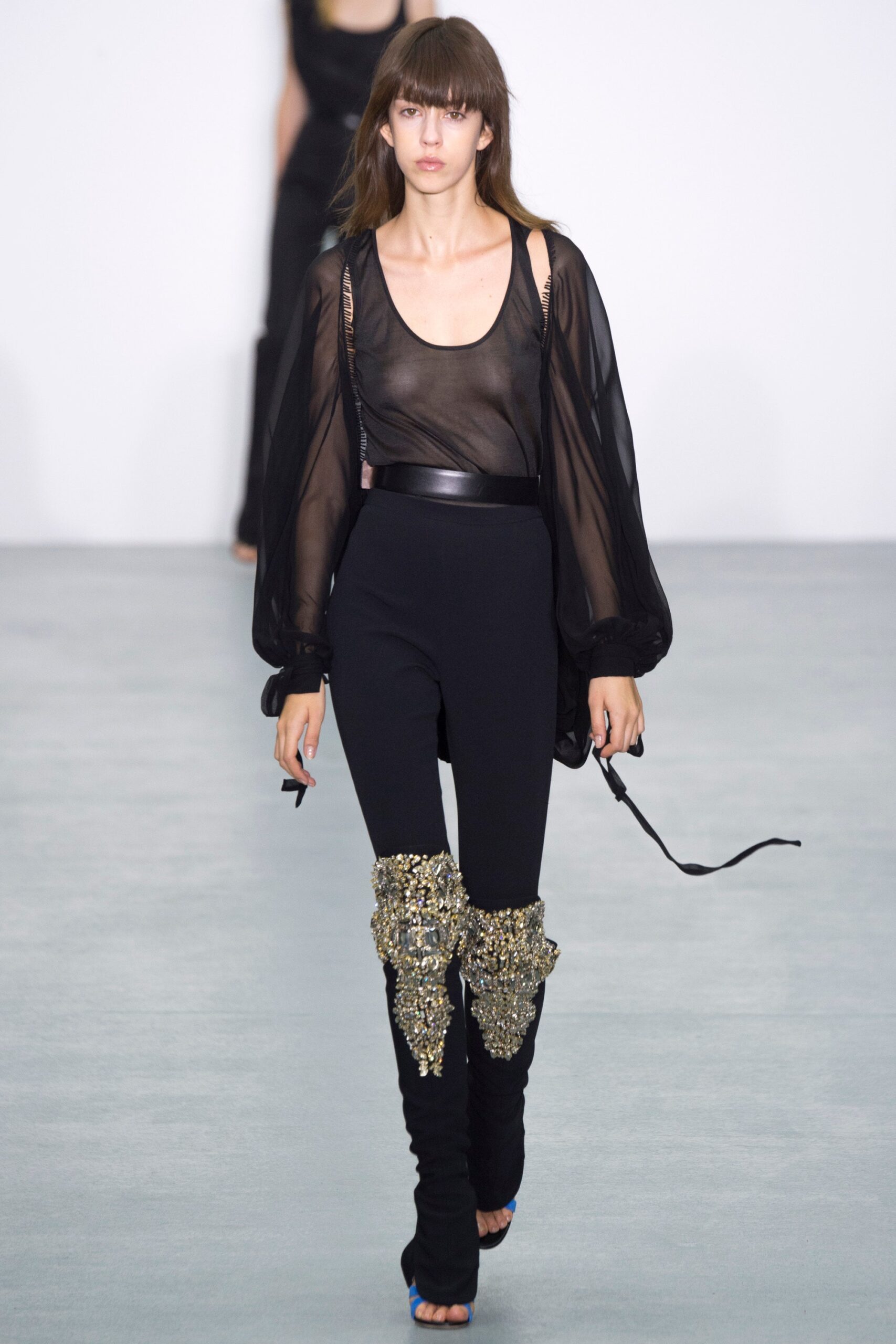 black sheer top with fitted pants