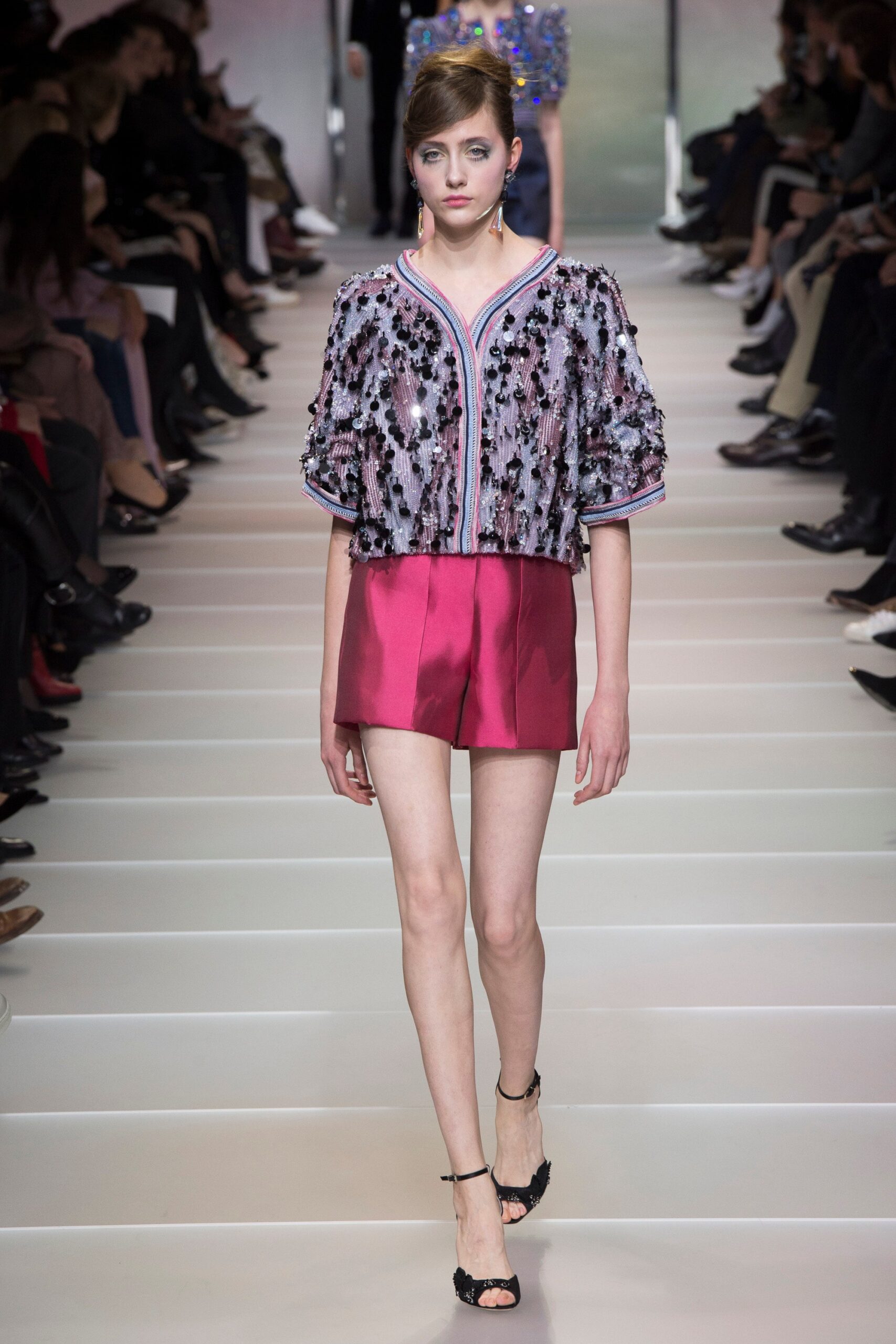 pink sequined top with red shorts