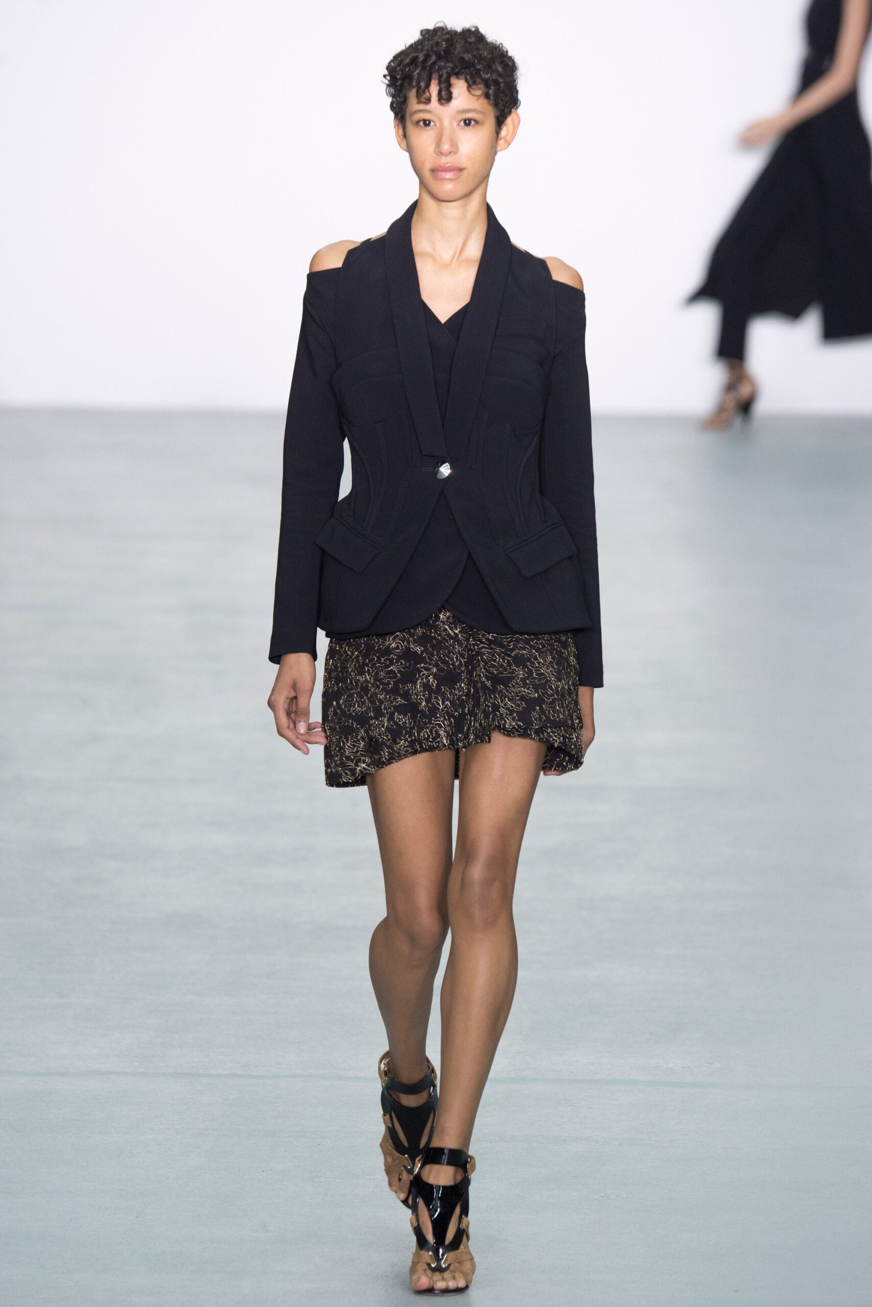 black fitted blazer and mini skirt