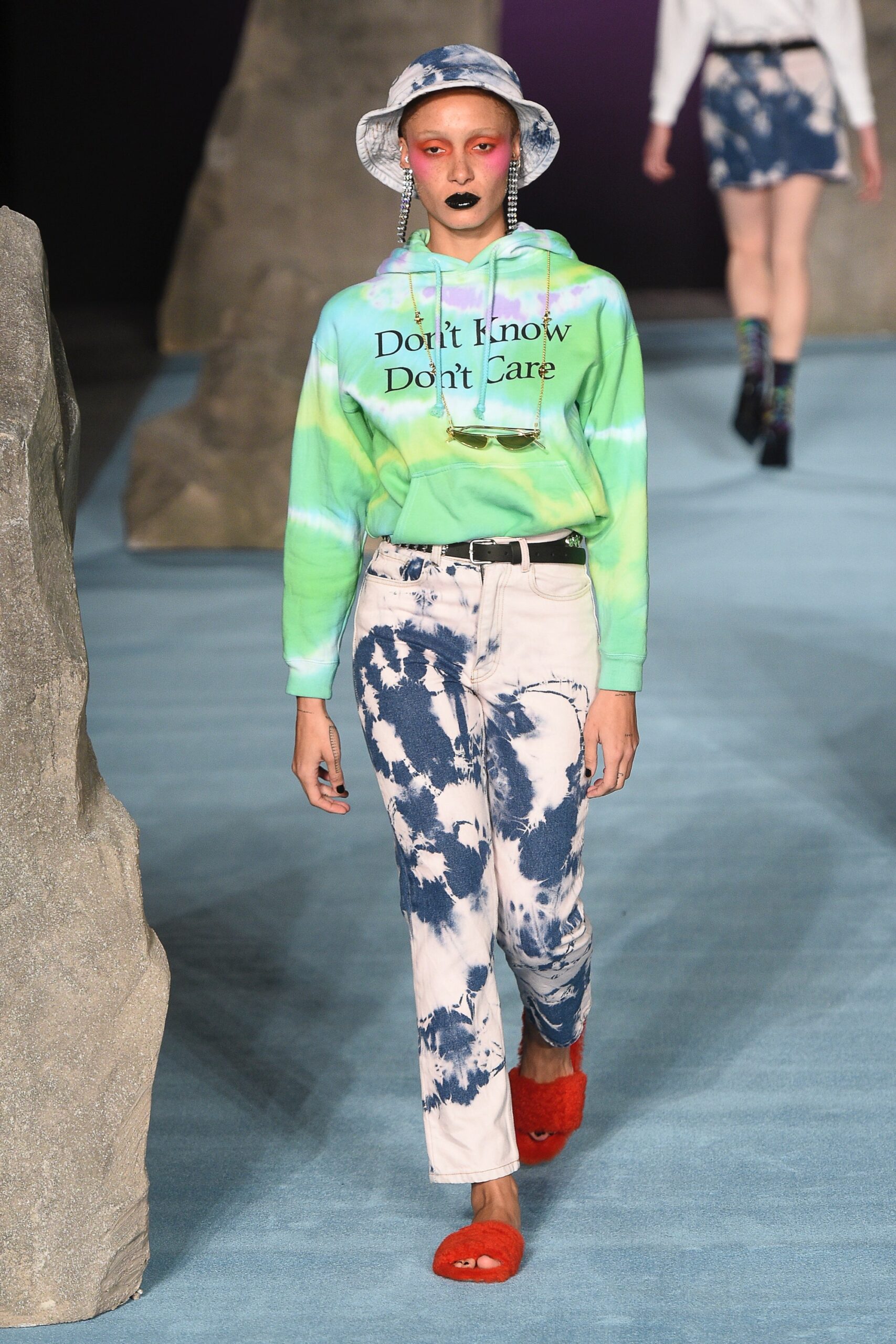 green printed hoodie with denim pants