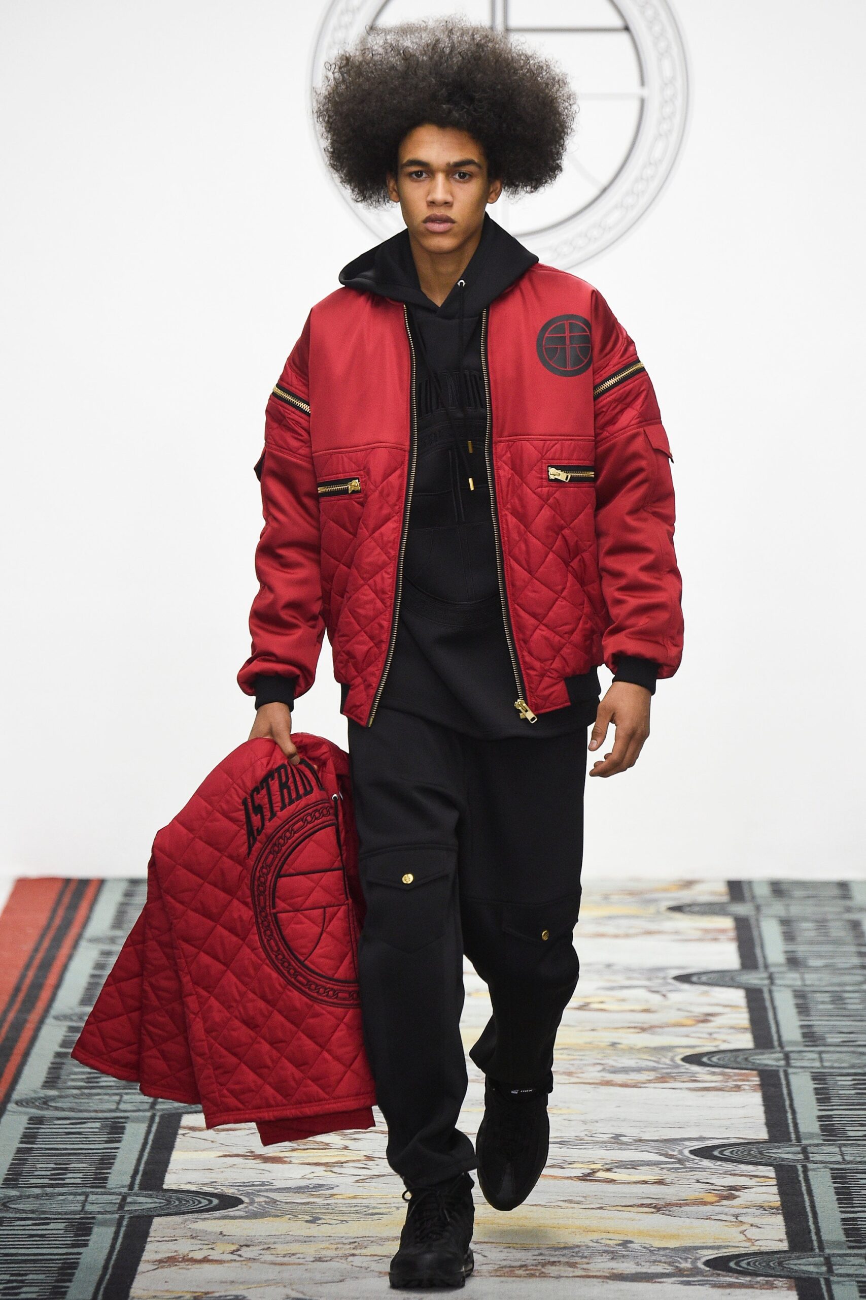 red quilted jacket with black hoodie