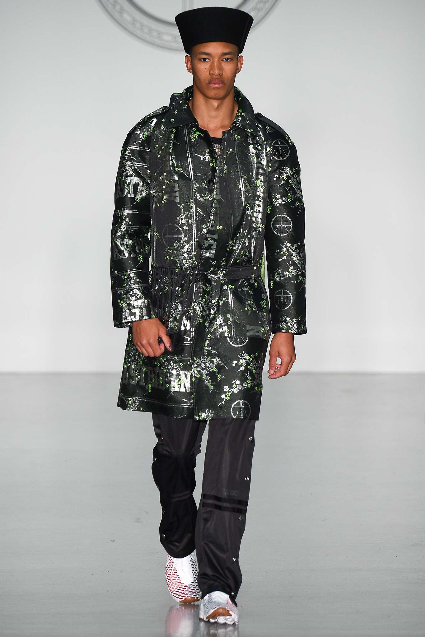 black vinyl long-sleeve collared relaxed buttoned printed coat