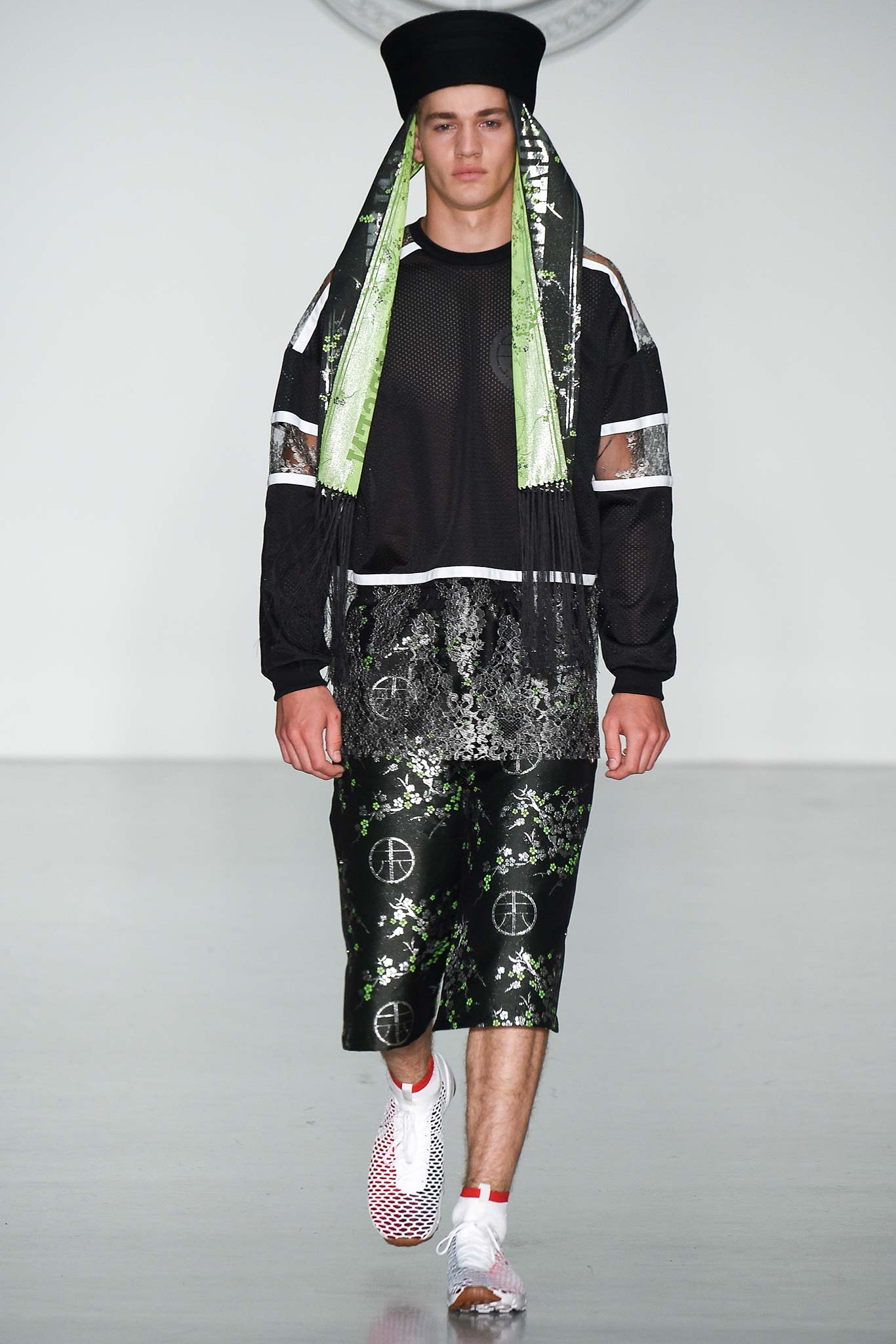 black mesh top with green shorts