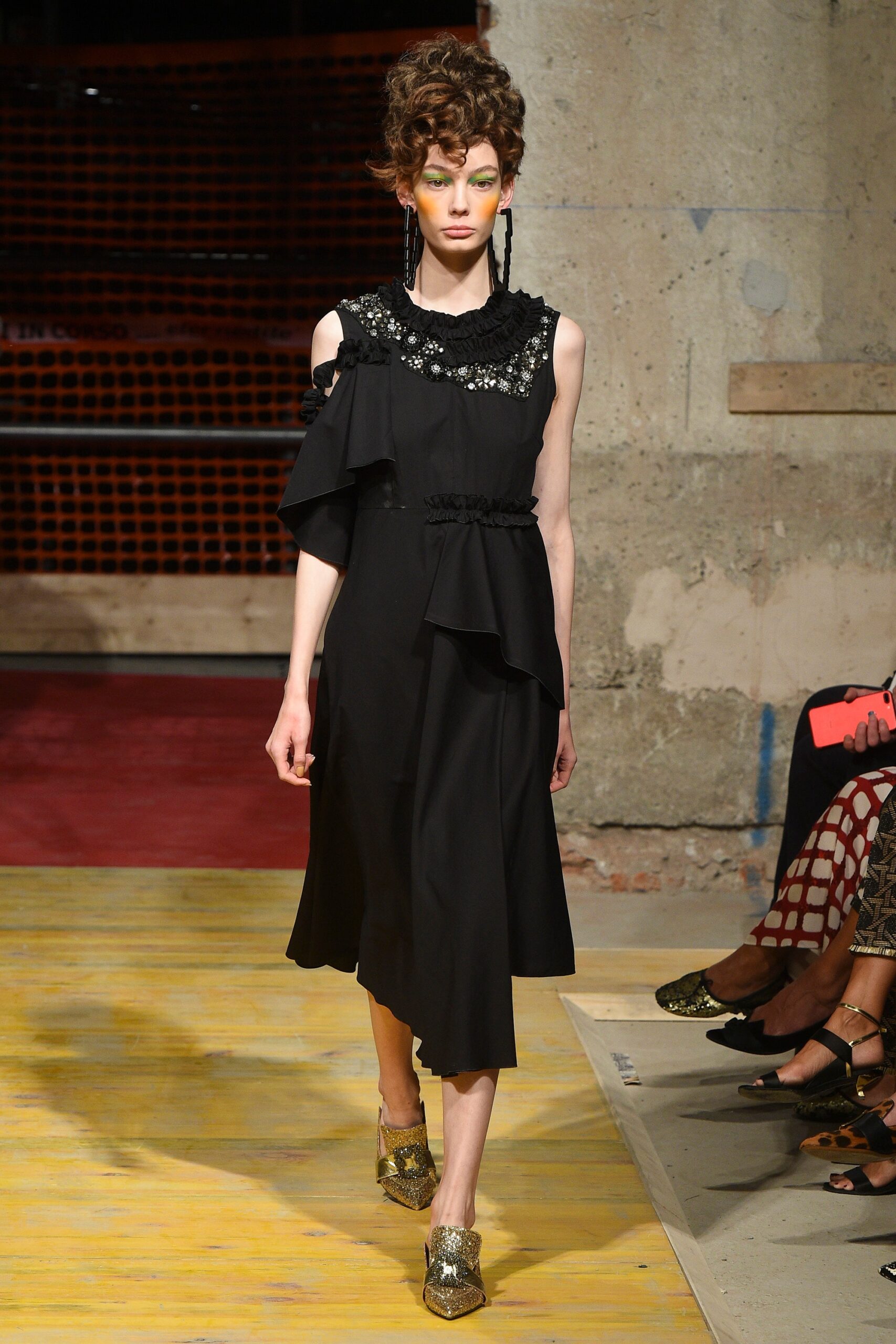 black silk ruffled midi dress with gold shoes