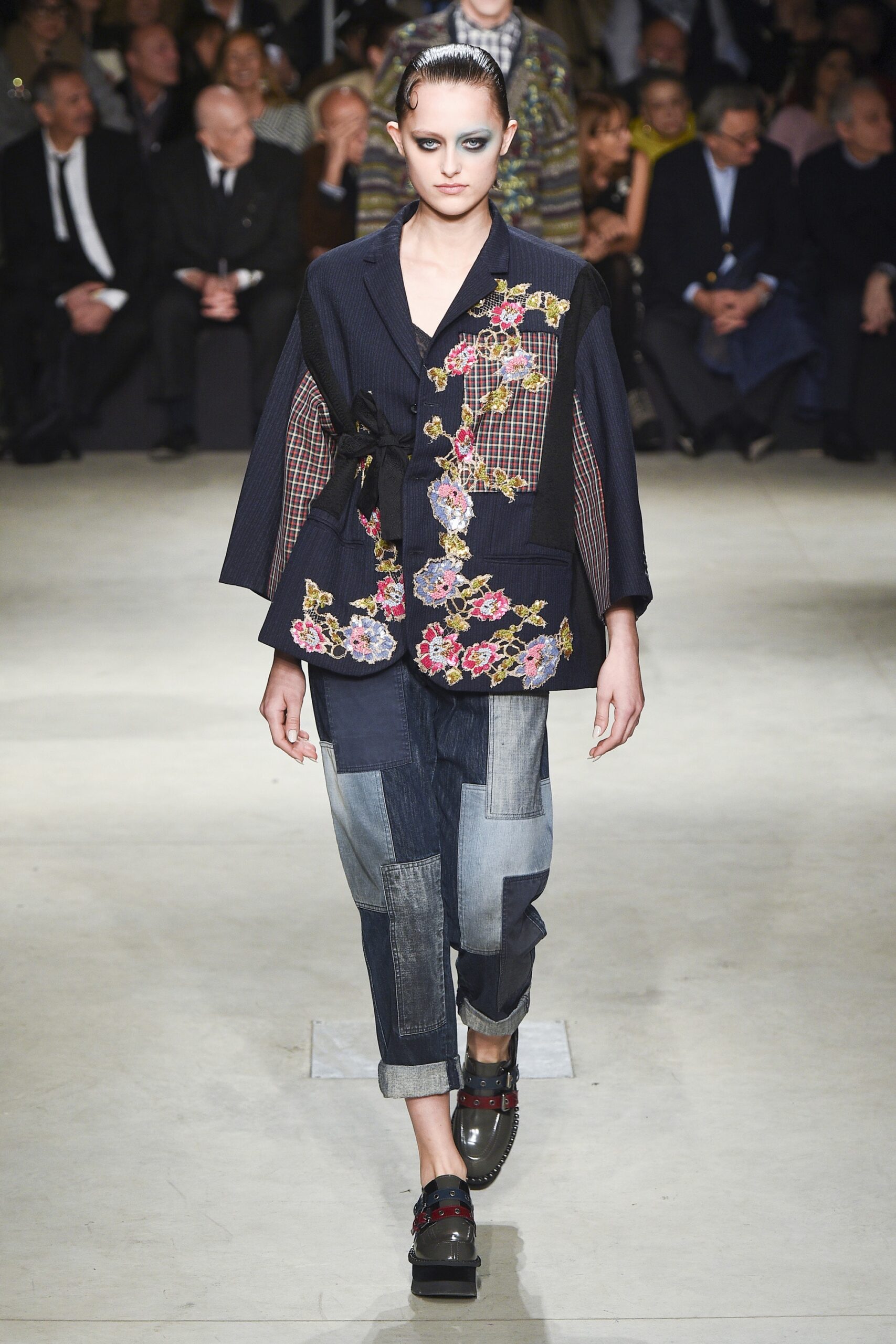 embroidered black jacket with denim pants