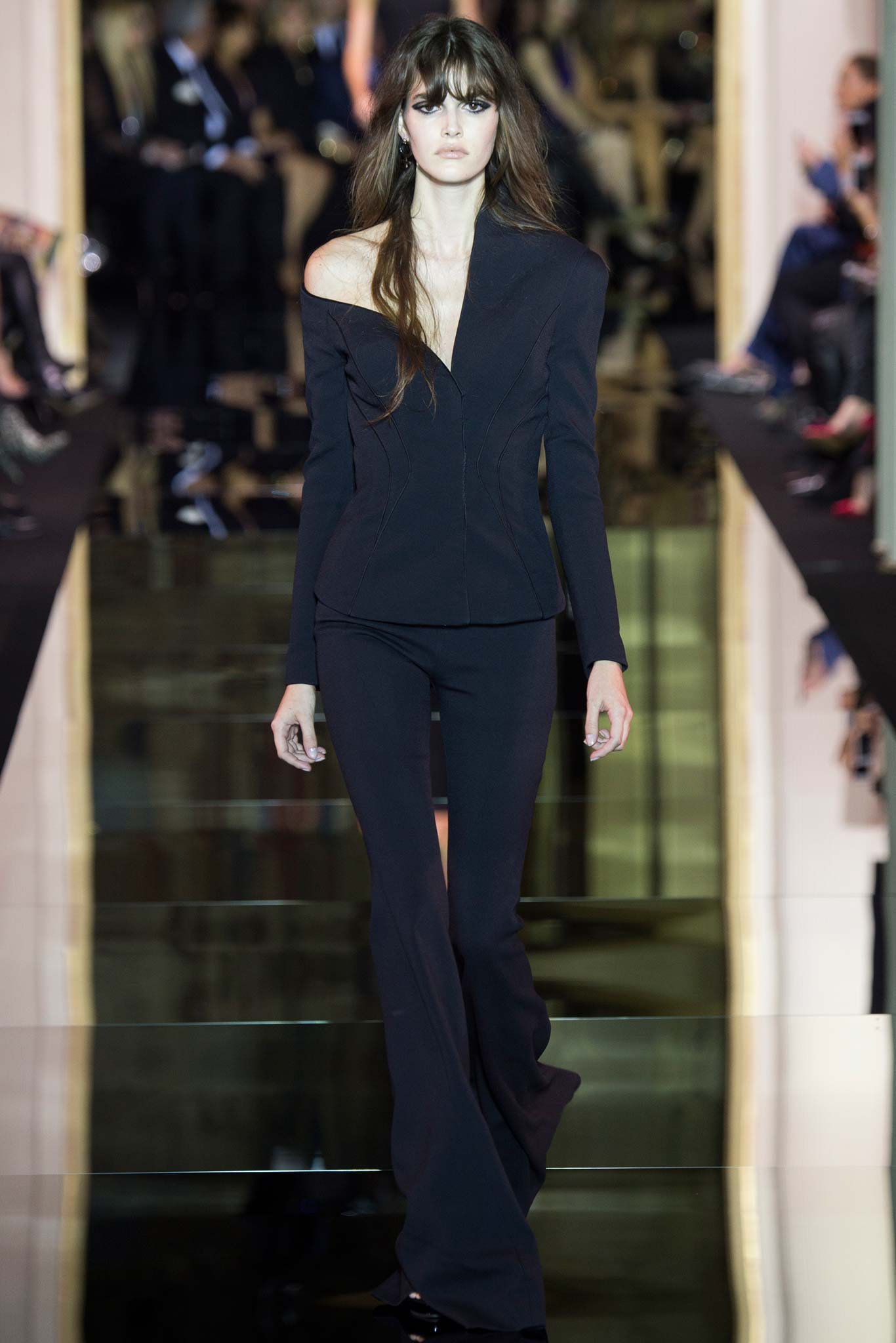 black tailored blazer and flared pants