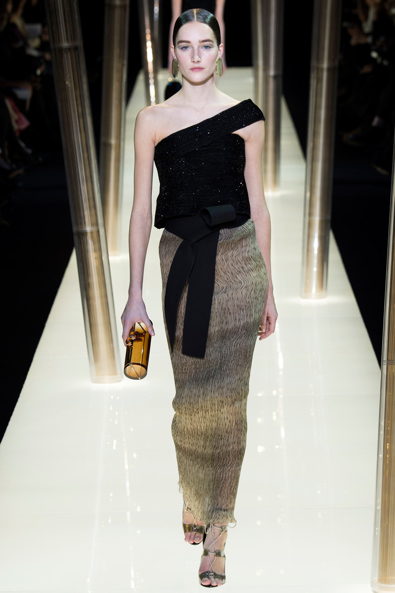 black asymmetric sequined top with pleated skirt