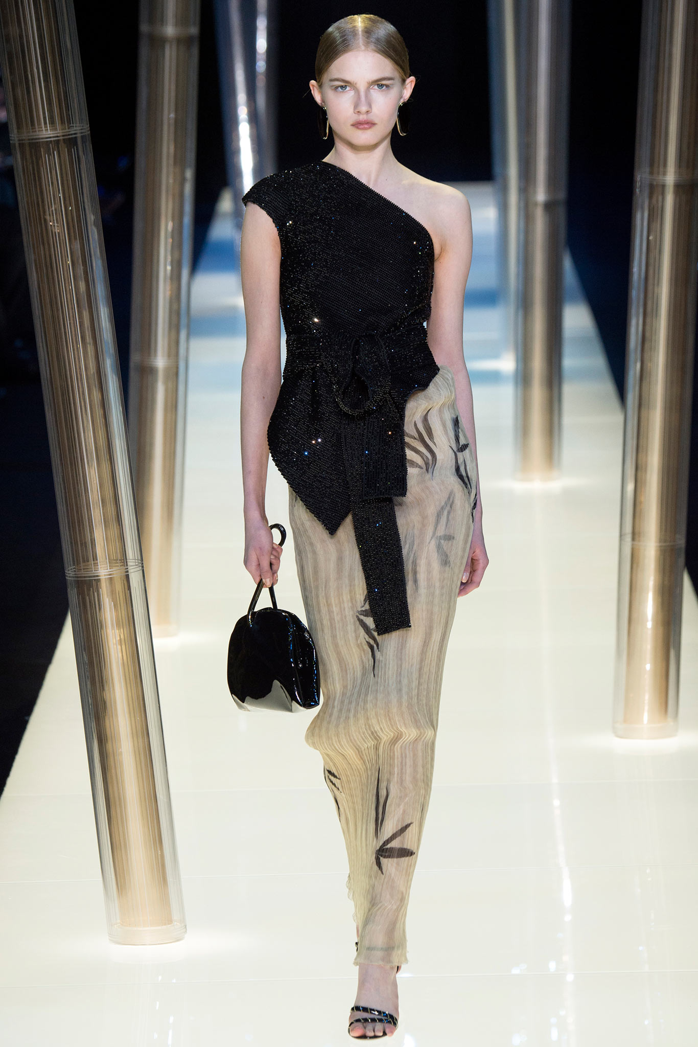 black sequin asymmetric top with beige pants