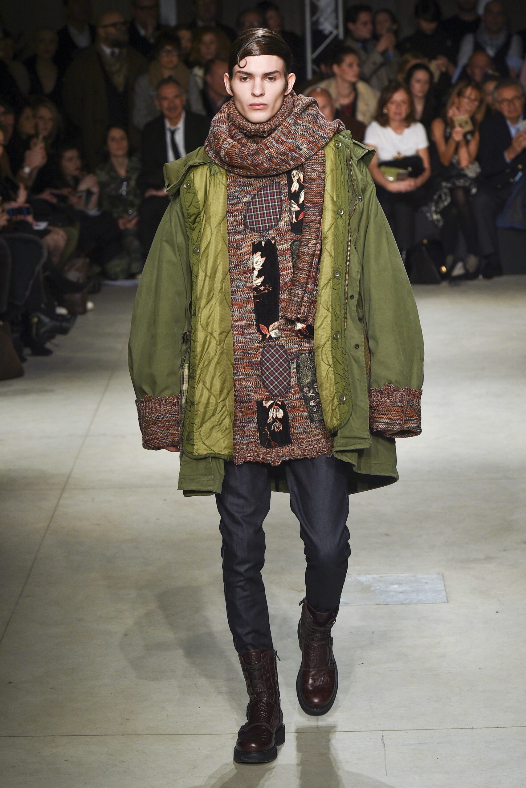 green coat multi sweater black pants