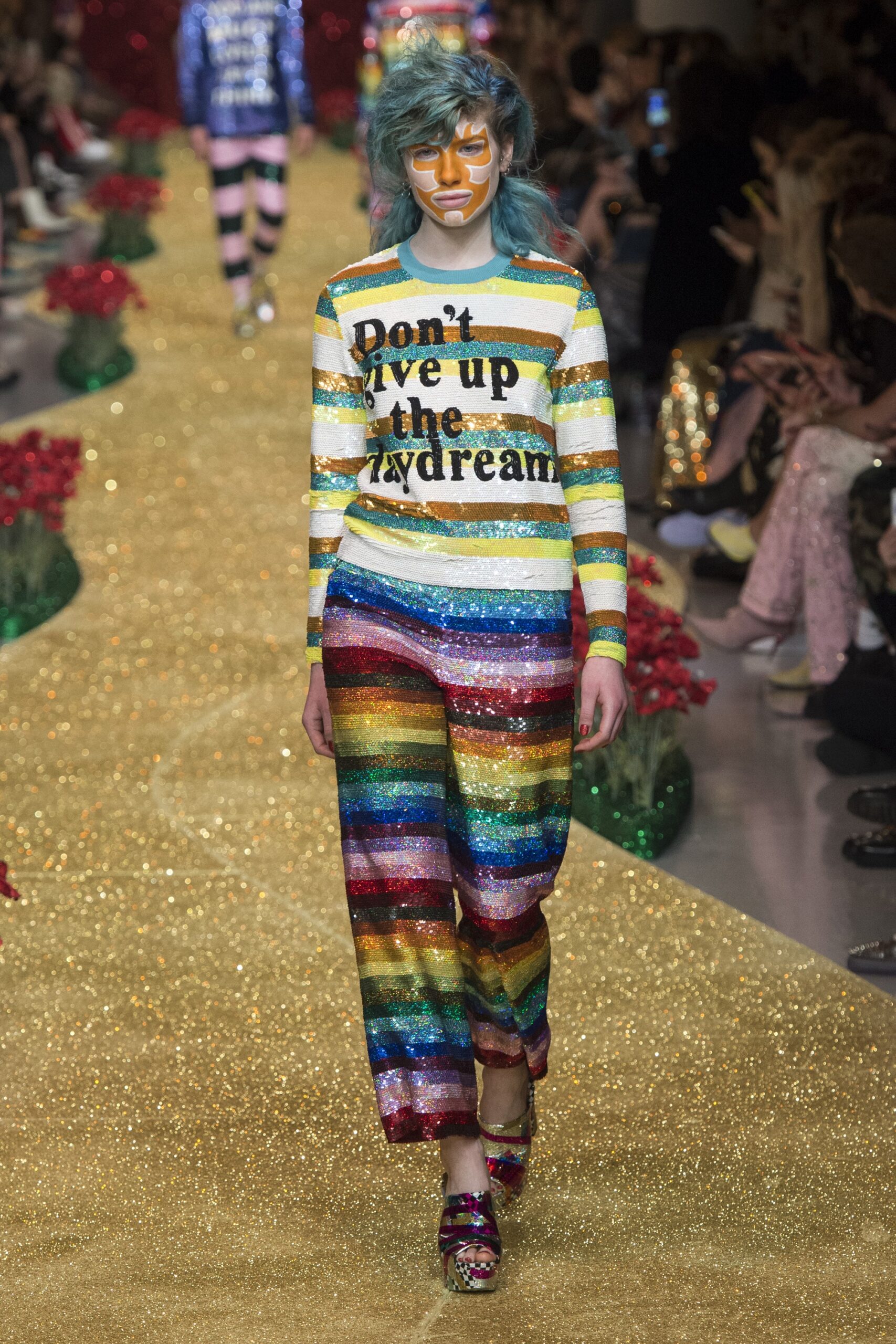 striped top with sequined pants