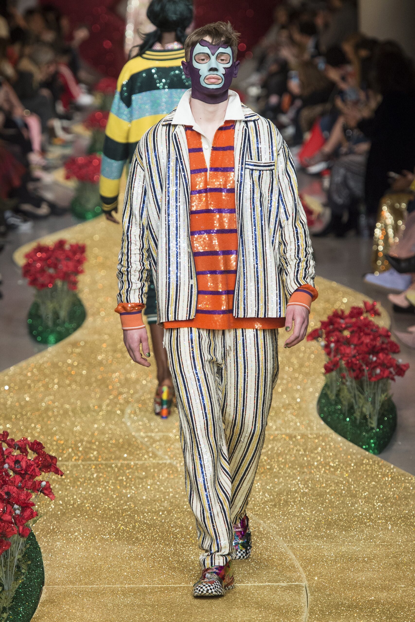 striped jacket and pants with orange t-shirt