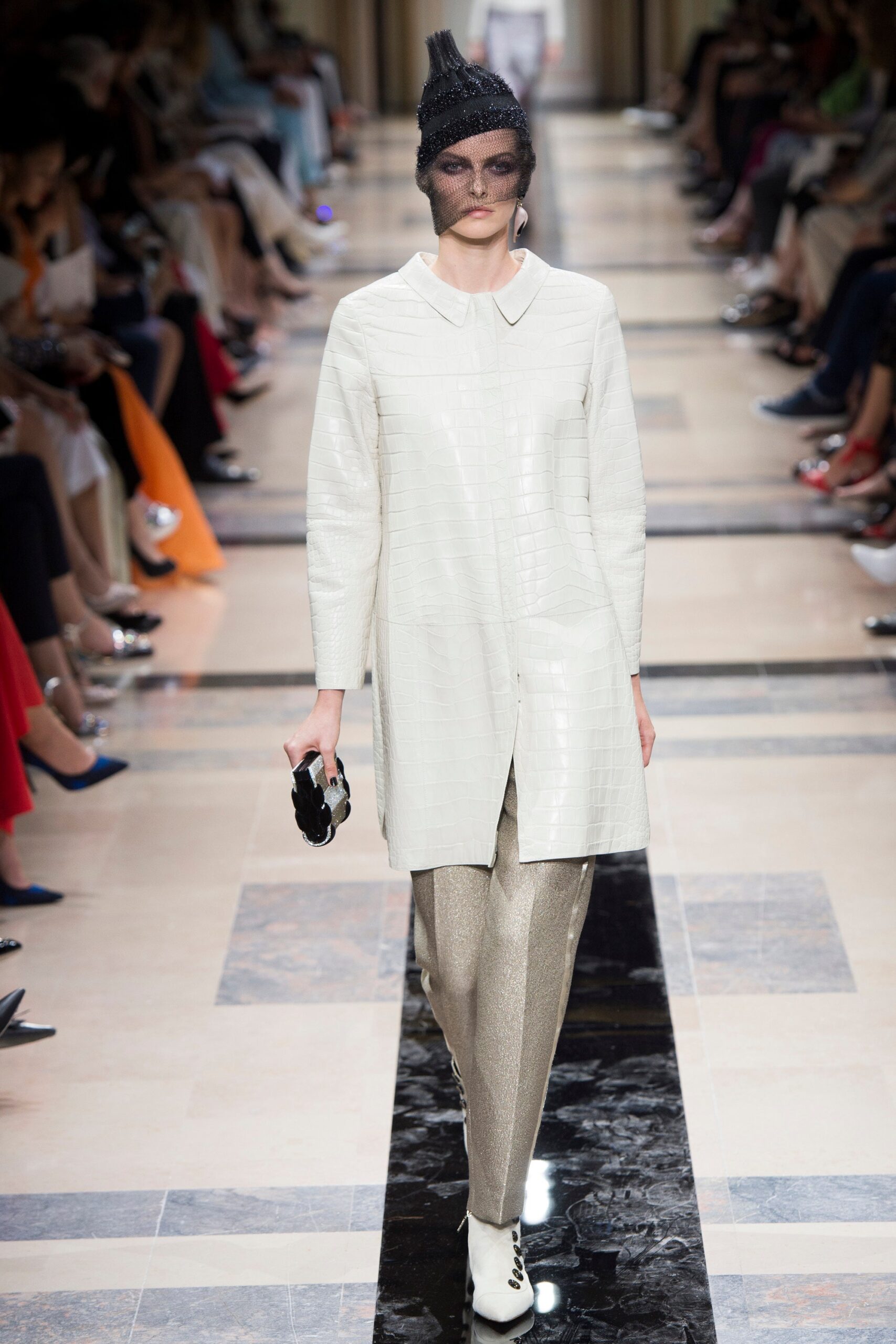 white leather shirt-dress with gold pants