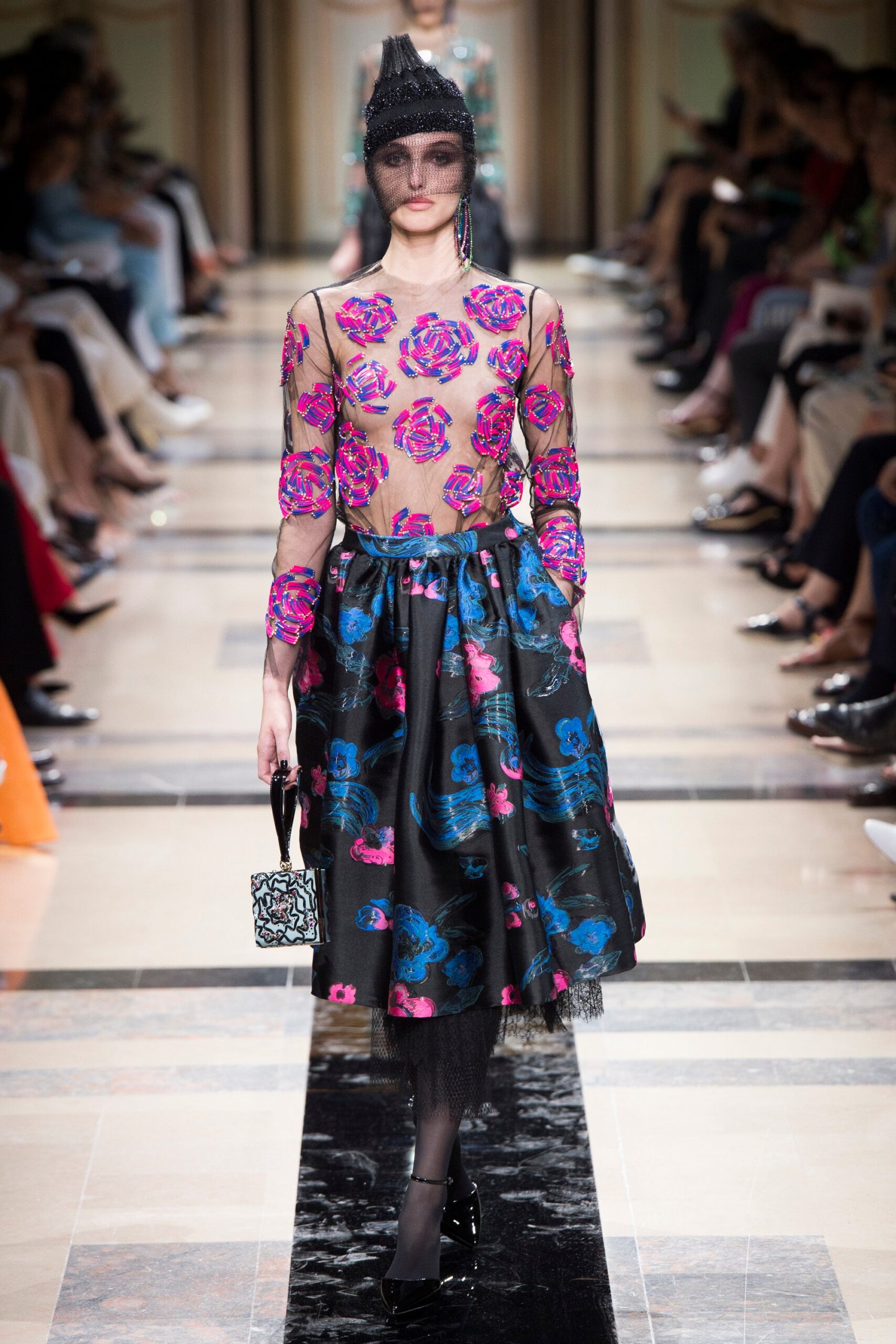 pink lace top and black flared skirt