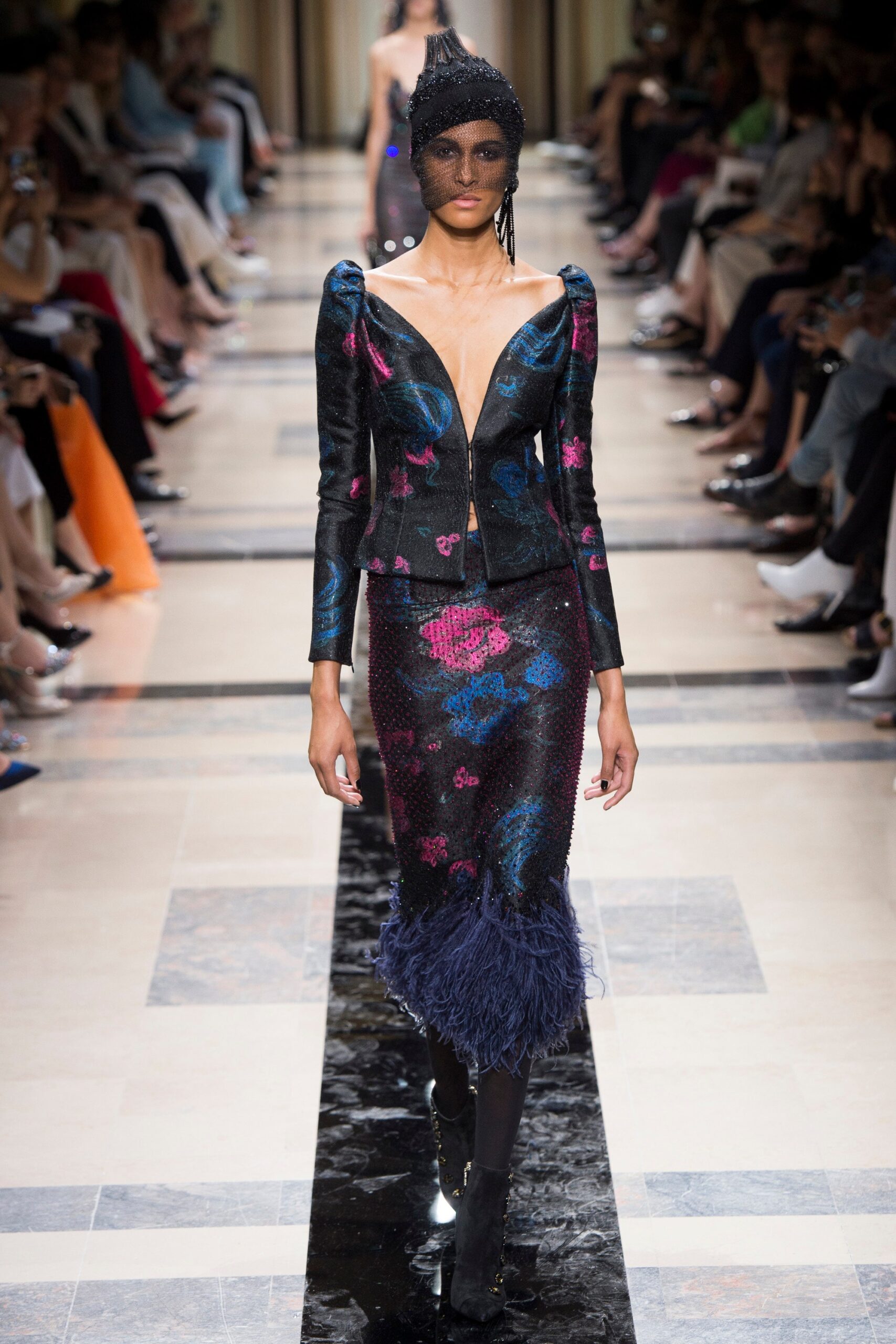 fitted blue silk jacket and black skirt