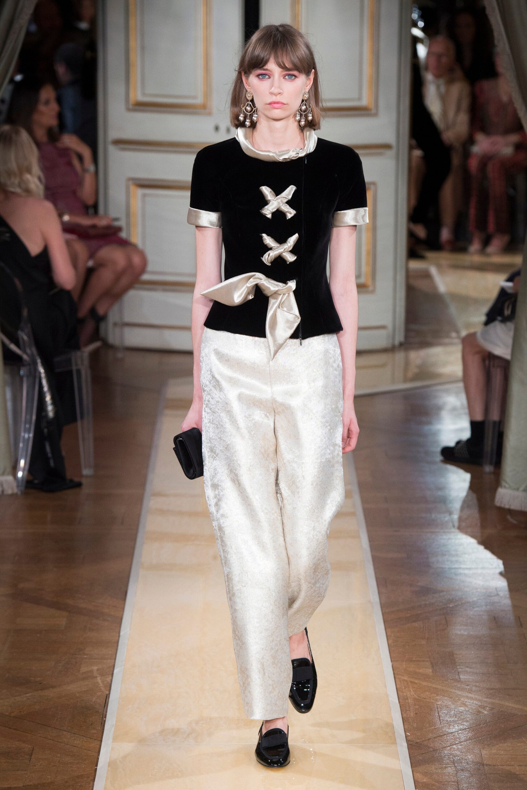 black velvet top with white pants