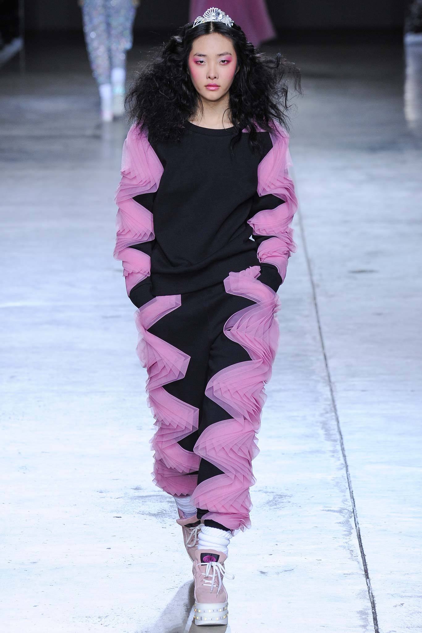 black relaxed sweater with pink pants