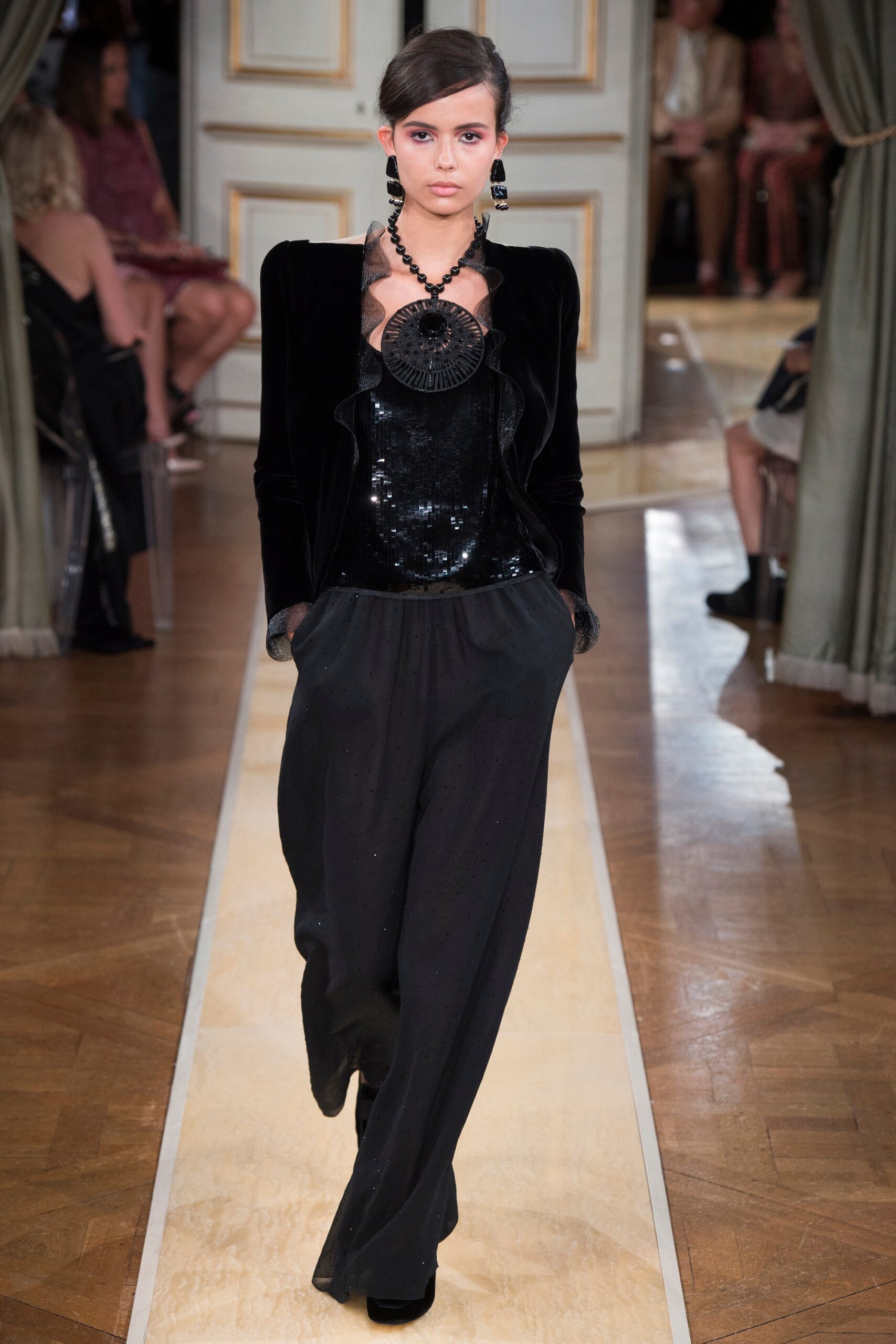 black sequined sleeveless top with wide-leg pants