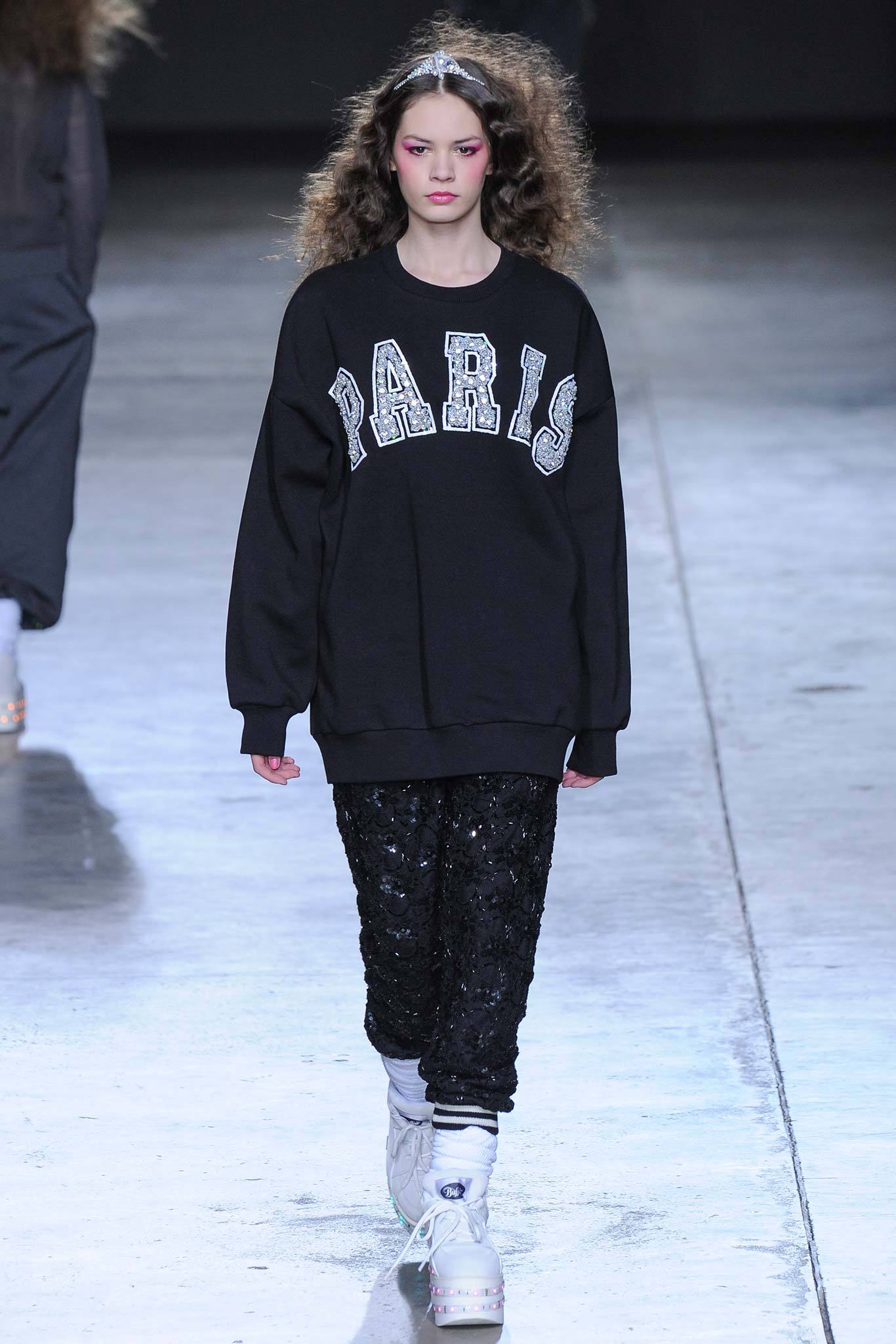 black relaxed sweater with sequined pants