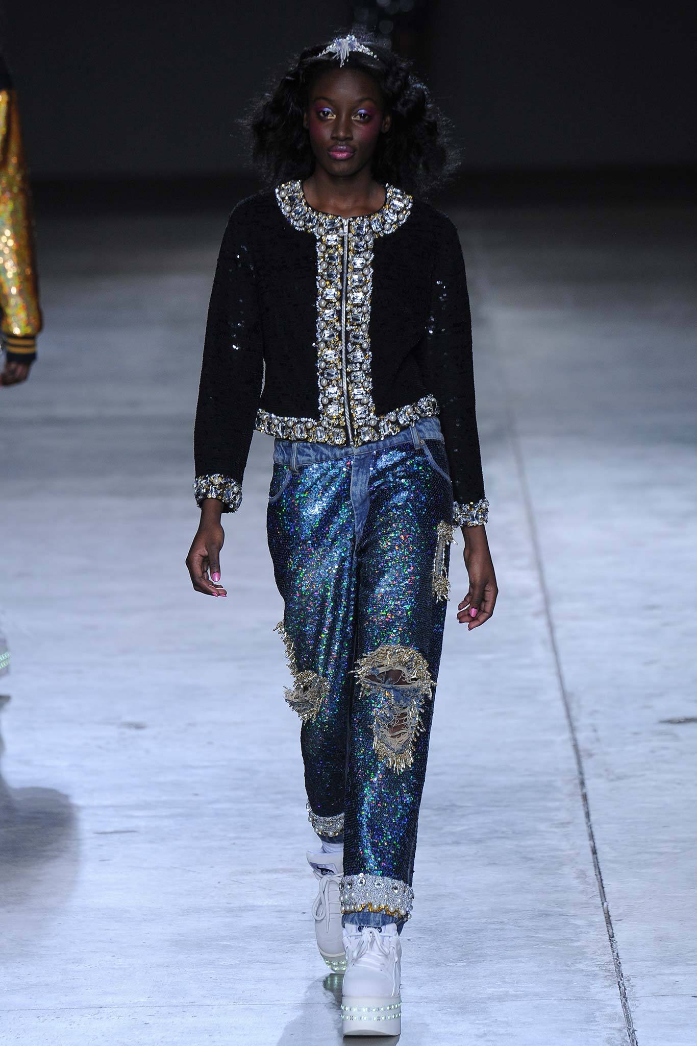 black sequin jacket and blue denim pants