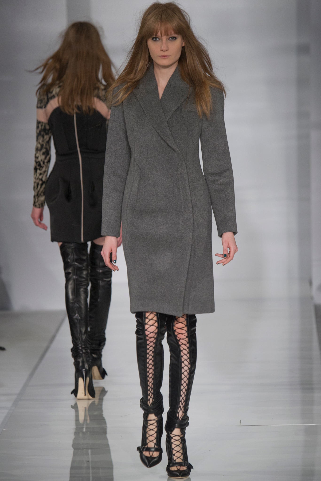 gray wool fitted coat with black leather pants