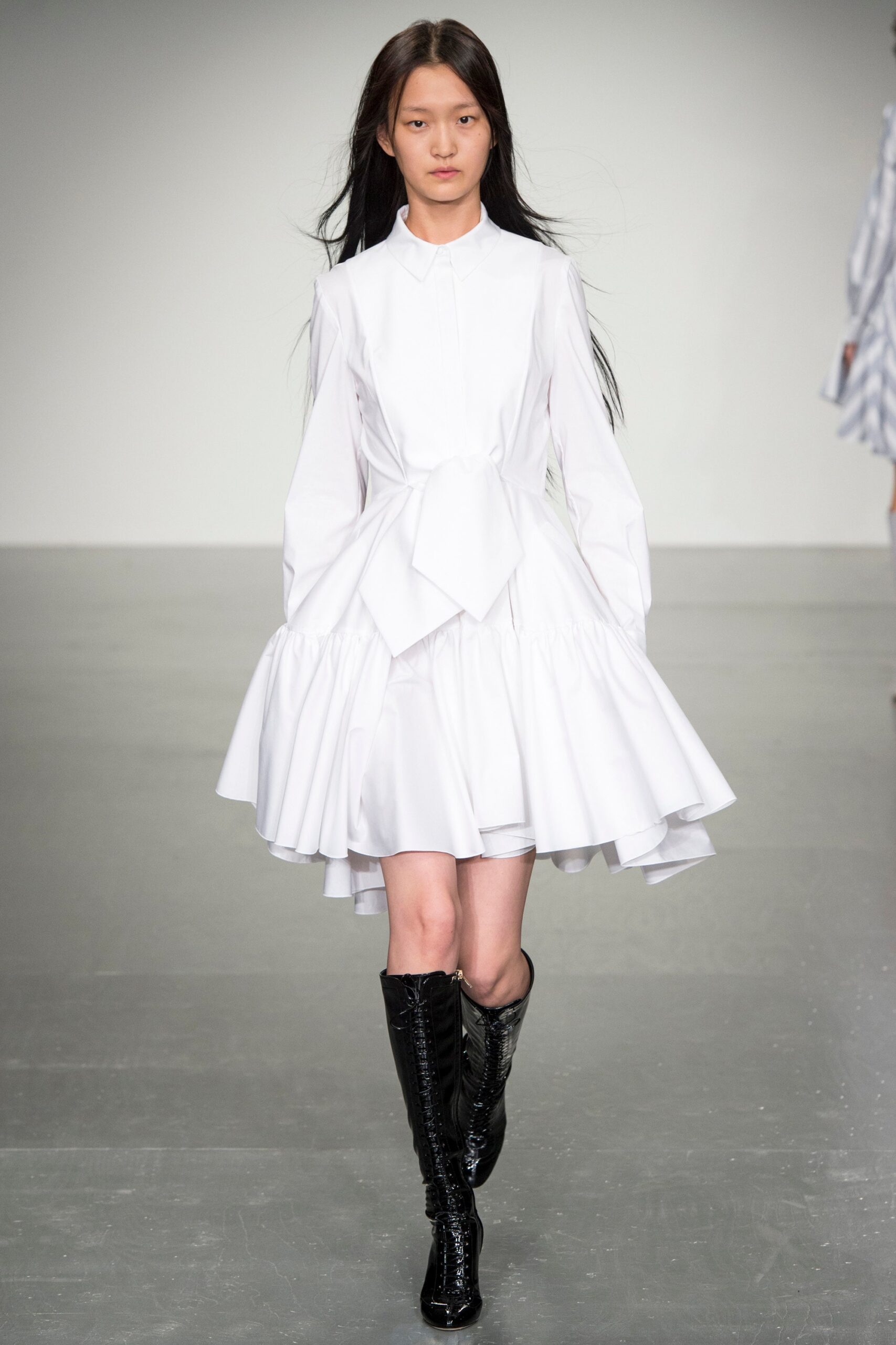 white pleated mini dress with black boots