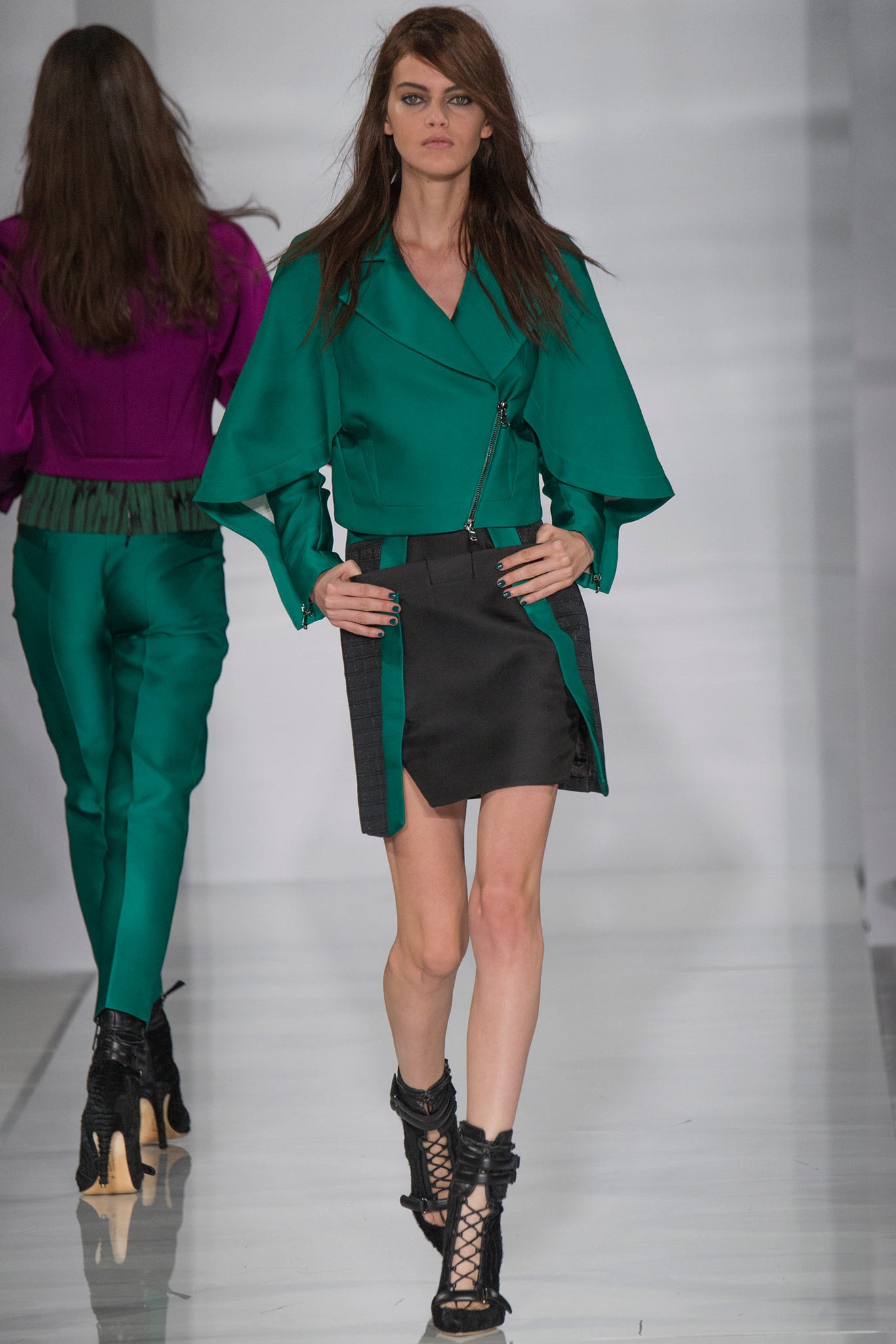 green silk fitted jacket and black skirt