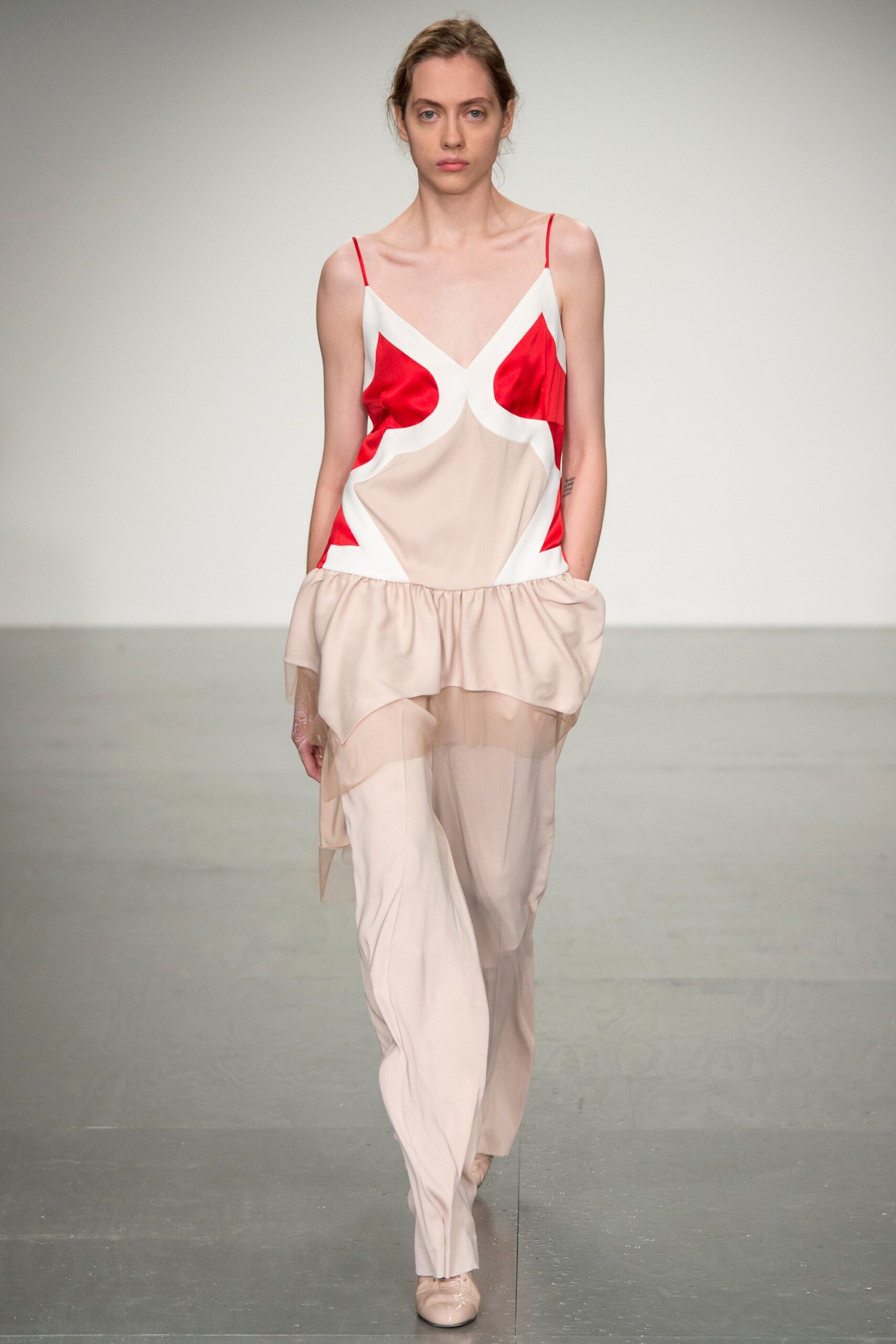 beige silk sleeveless top with red accents