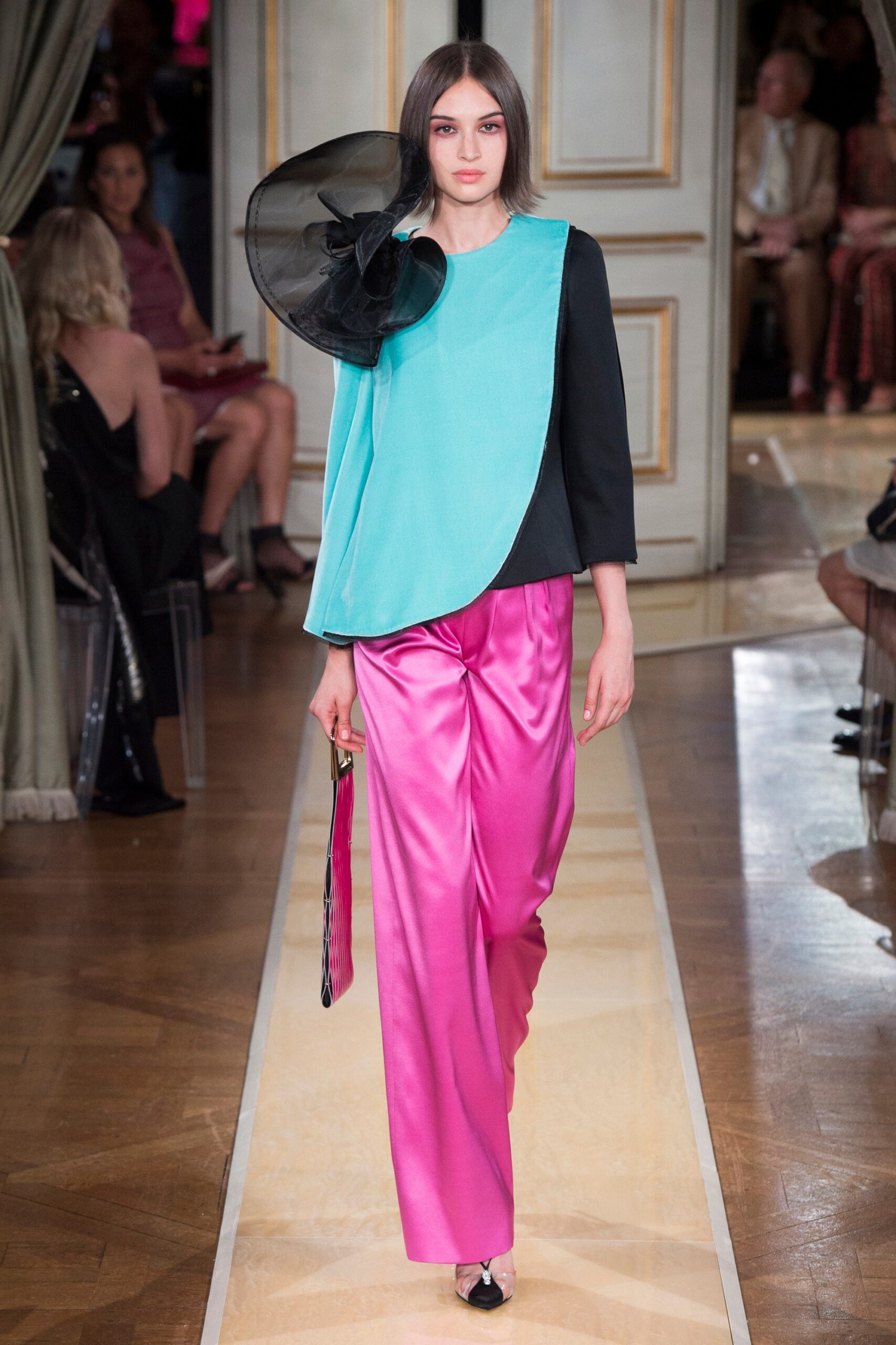 asymmetric black and blue top with pink pants