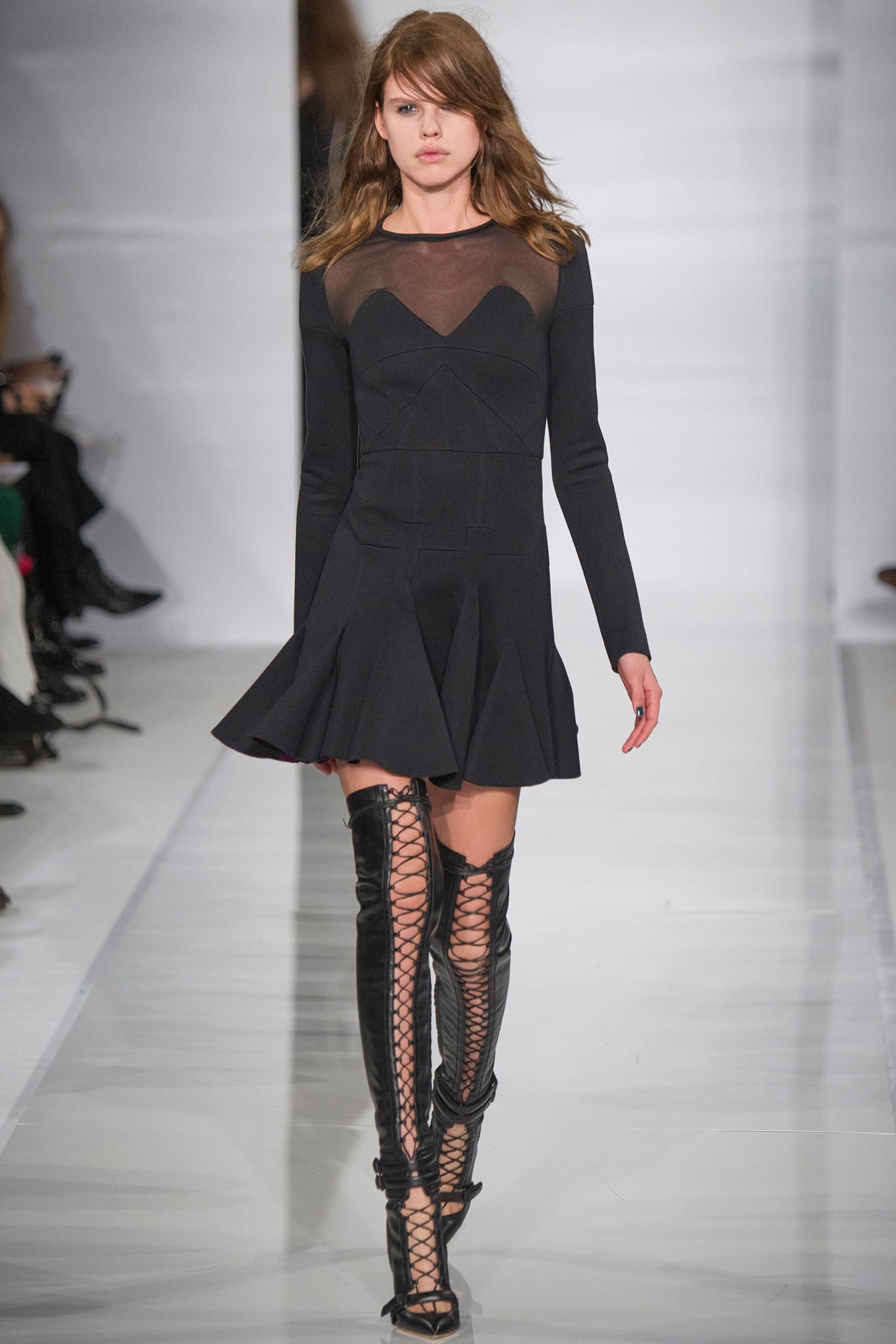 black fitted mini dress with boots