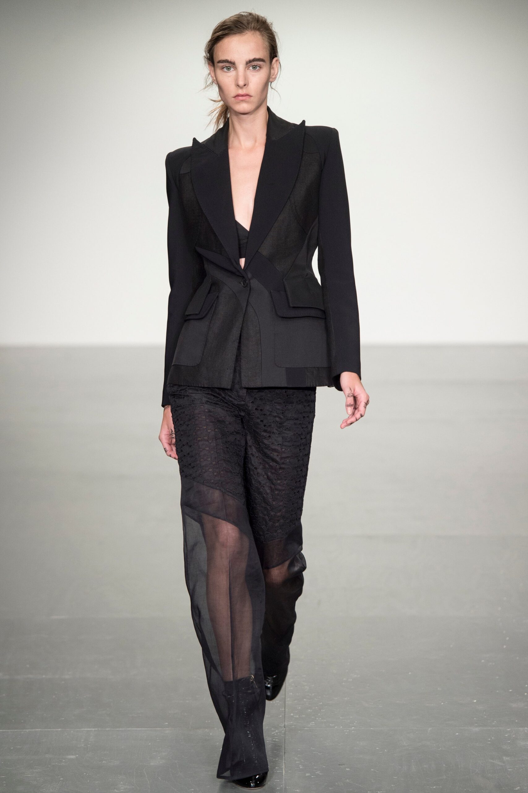 black structured blazer with sheer pants