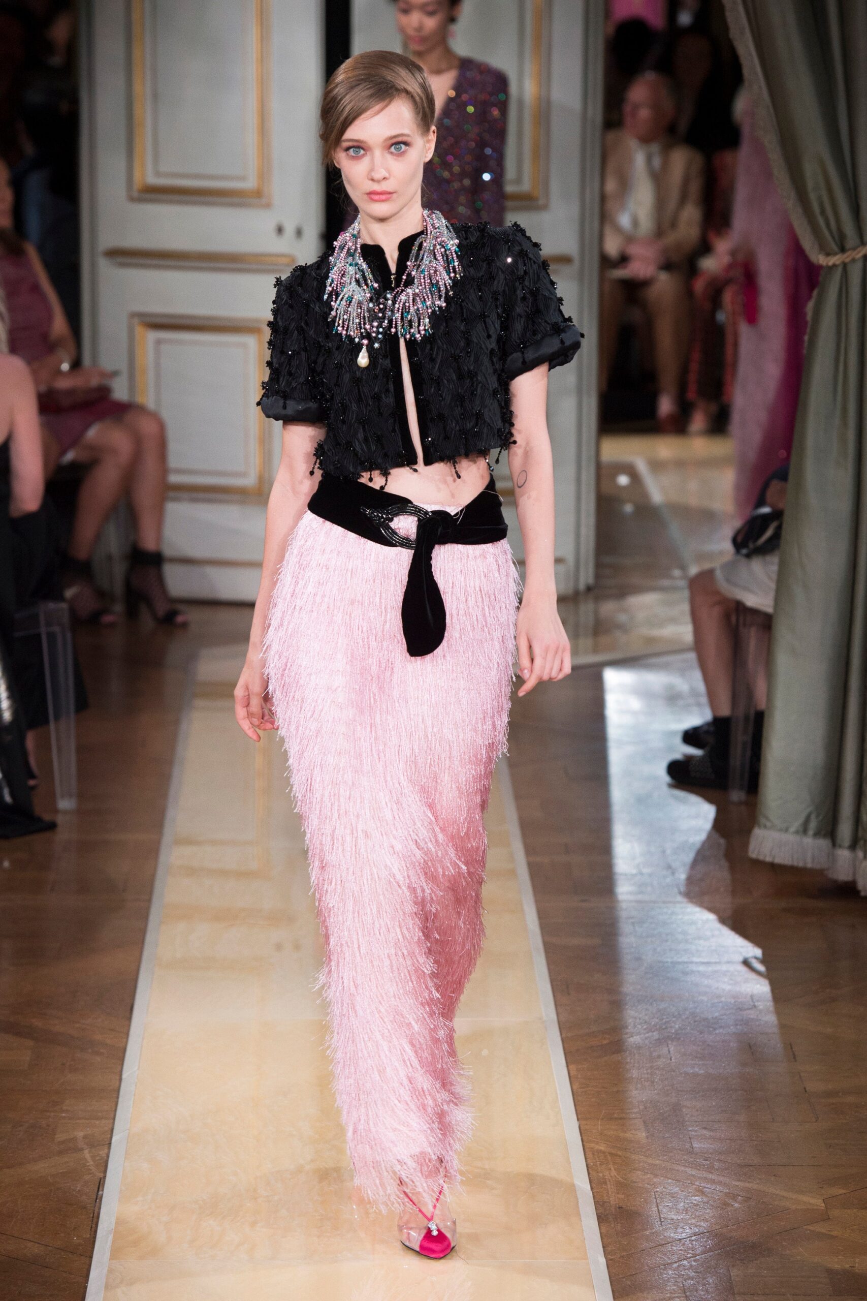 black ruffled top pink fringed skirt