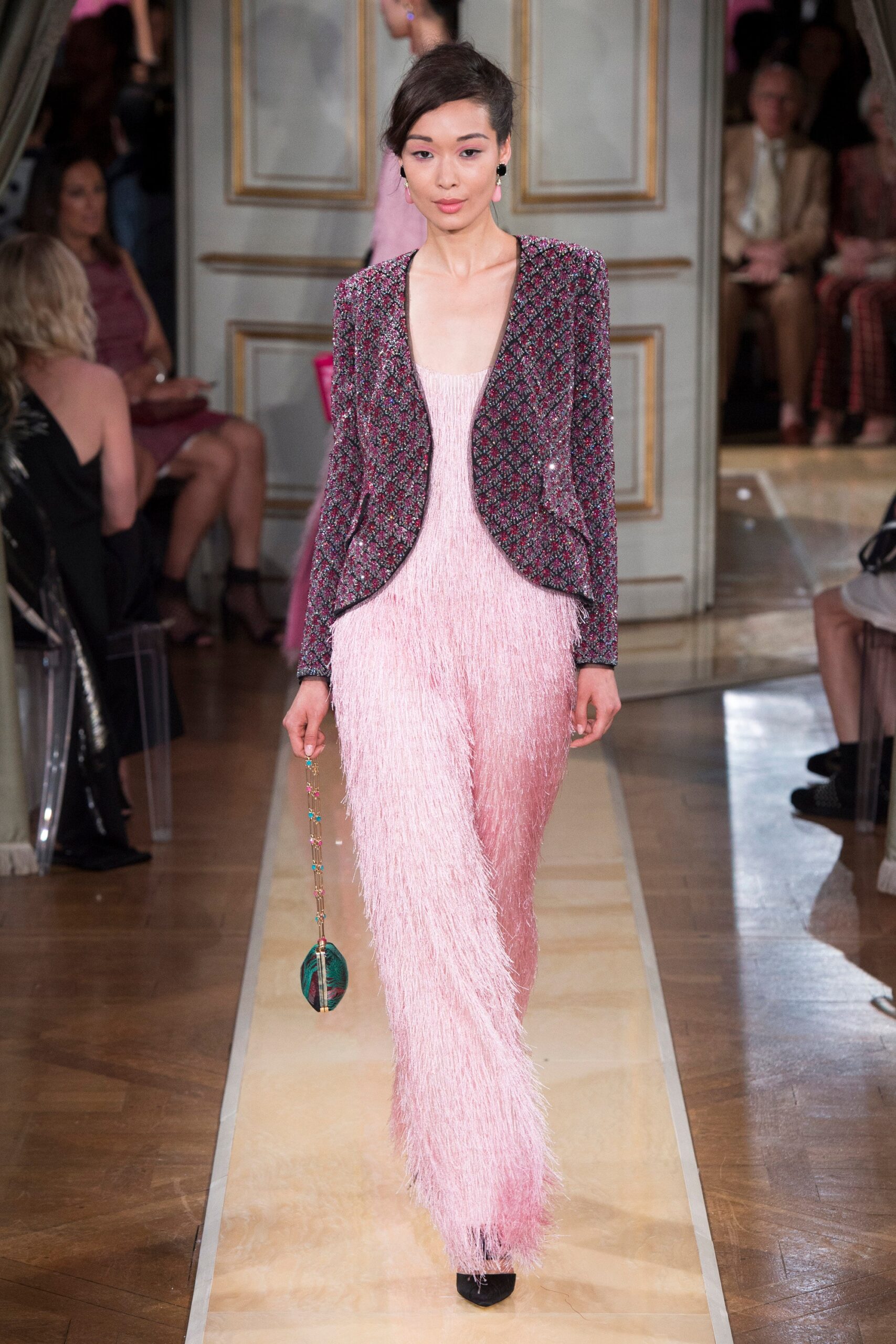 multi-colored tweed jacket and pink fringed jumpsuit