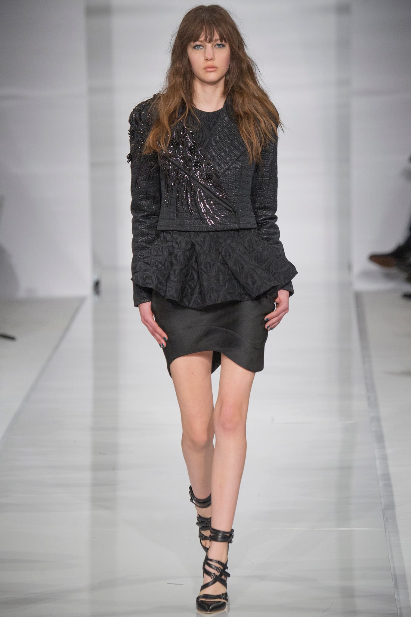 black fitted jacket and mini skirt