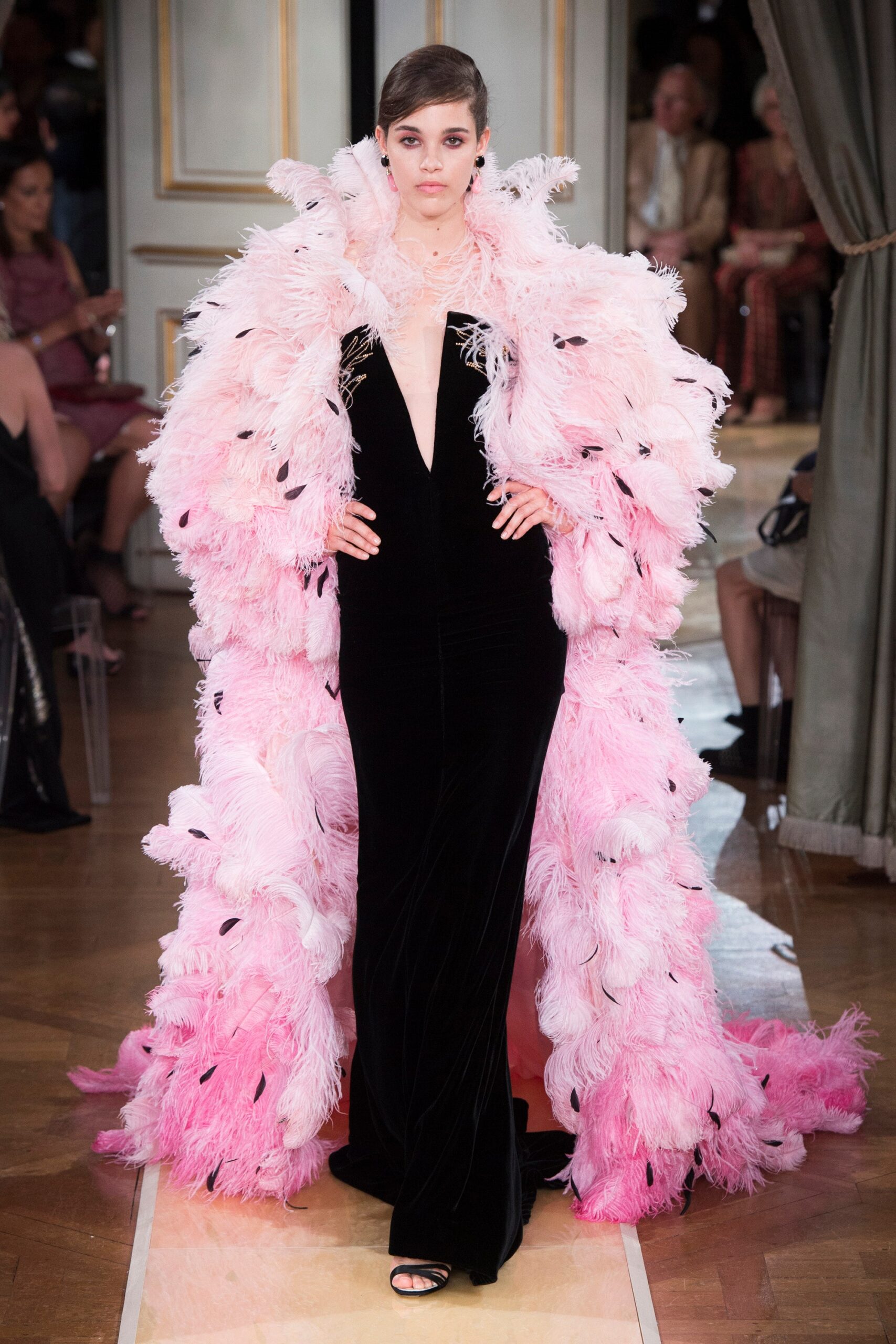 black velvet gown with pink feather cape