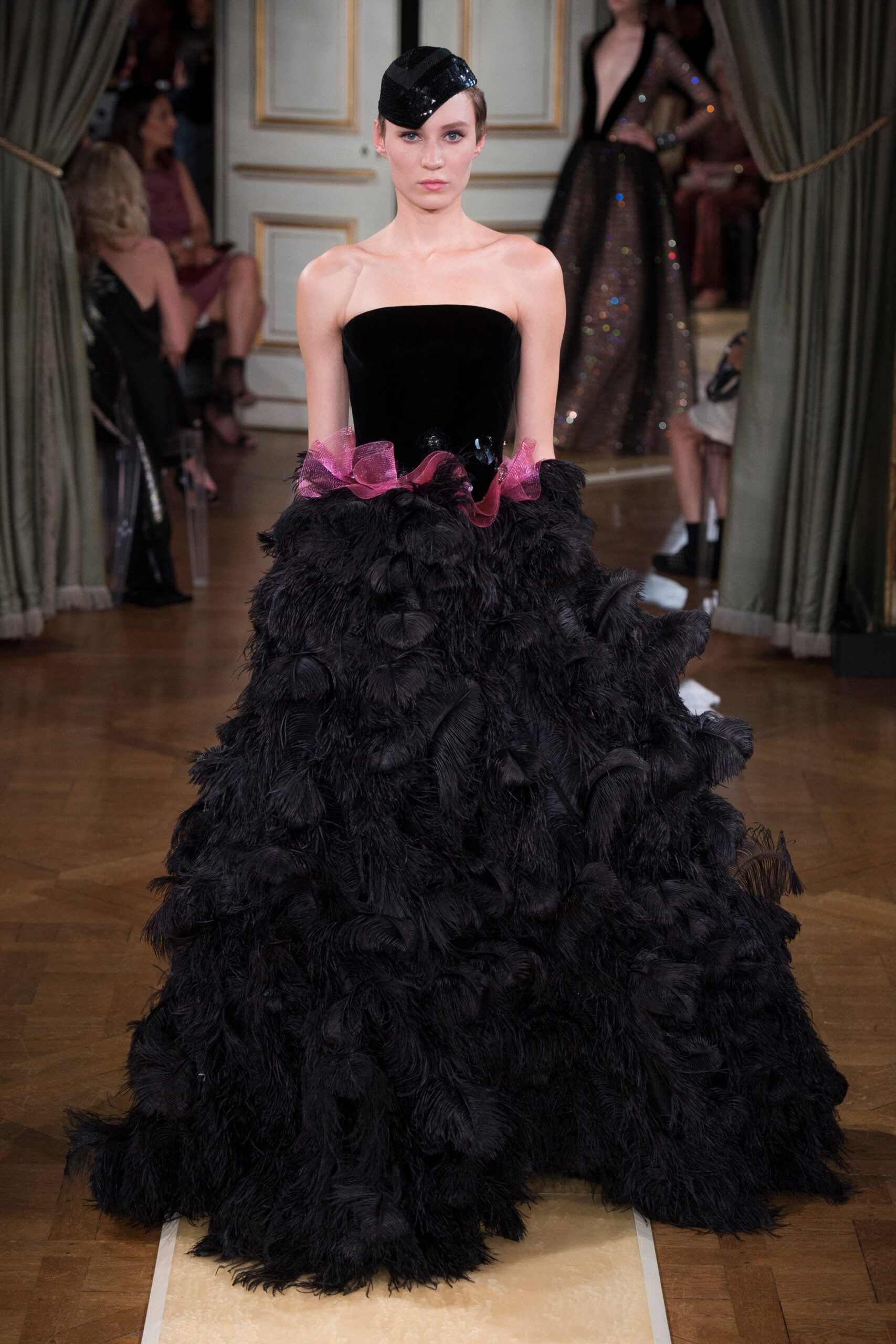 black feathered strapless gown