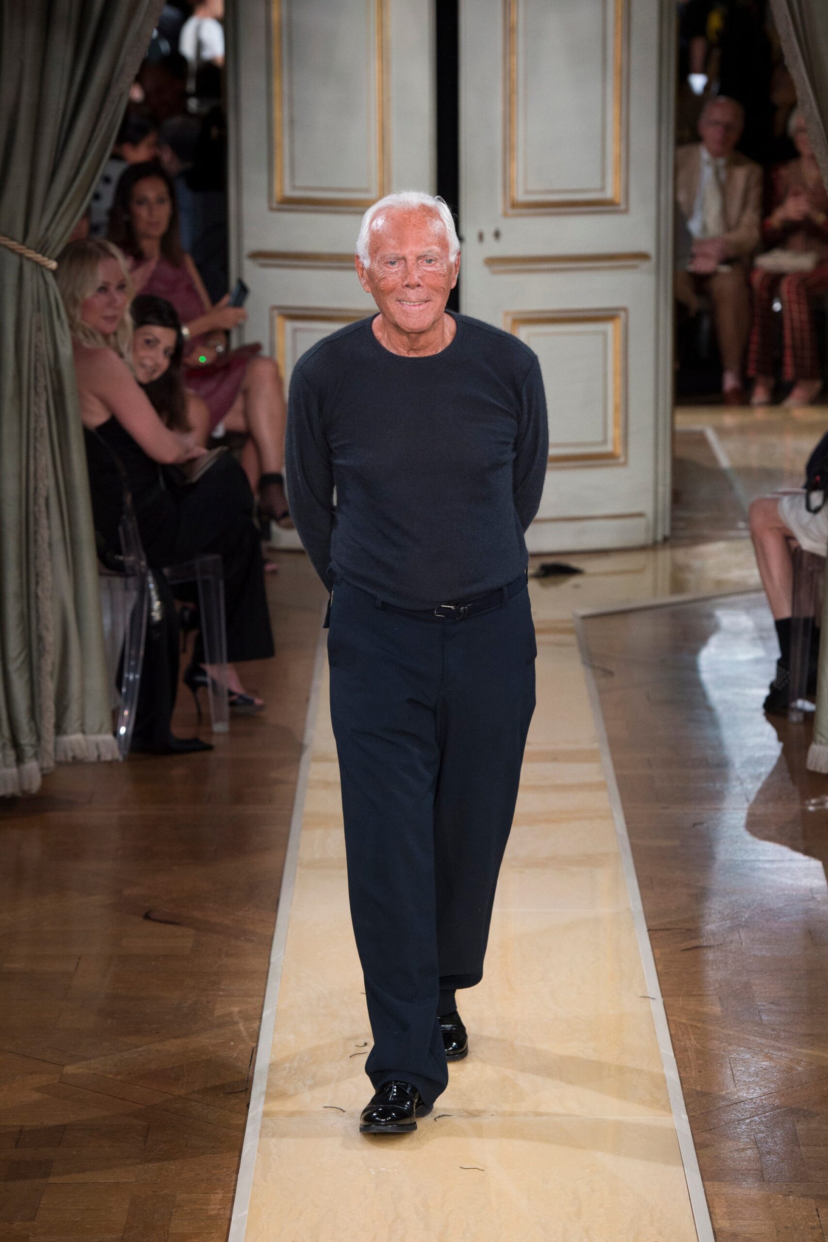 black fitted sweater and navy pants