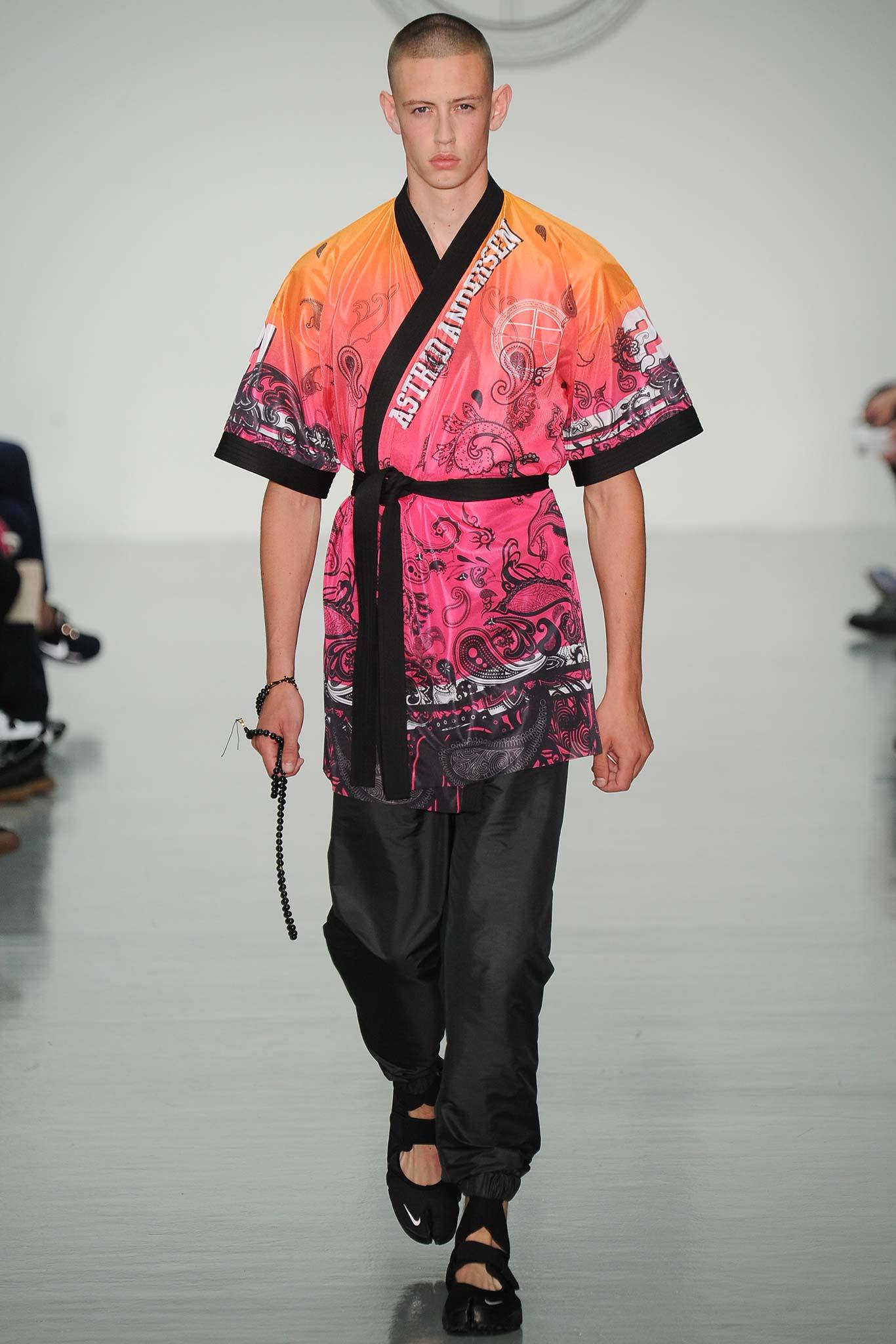 relaxed orange and pink top with black pants