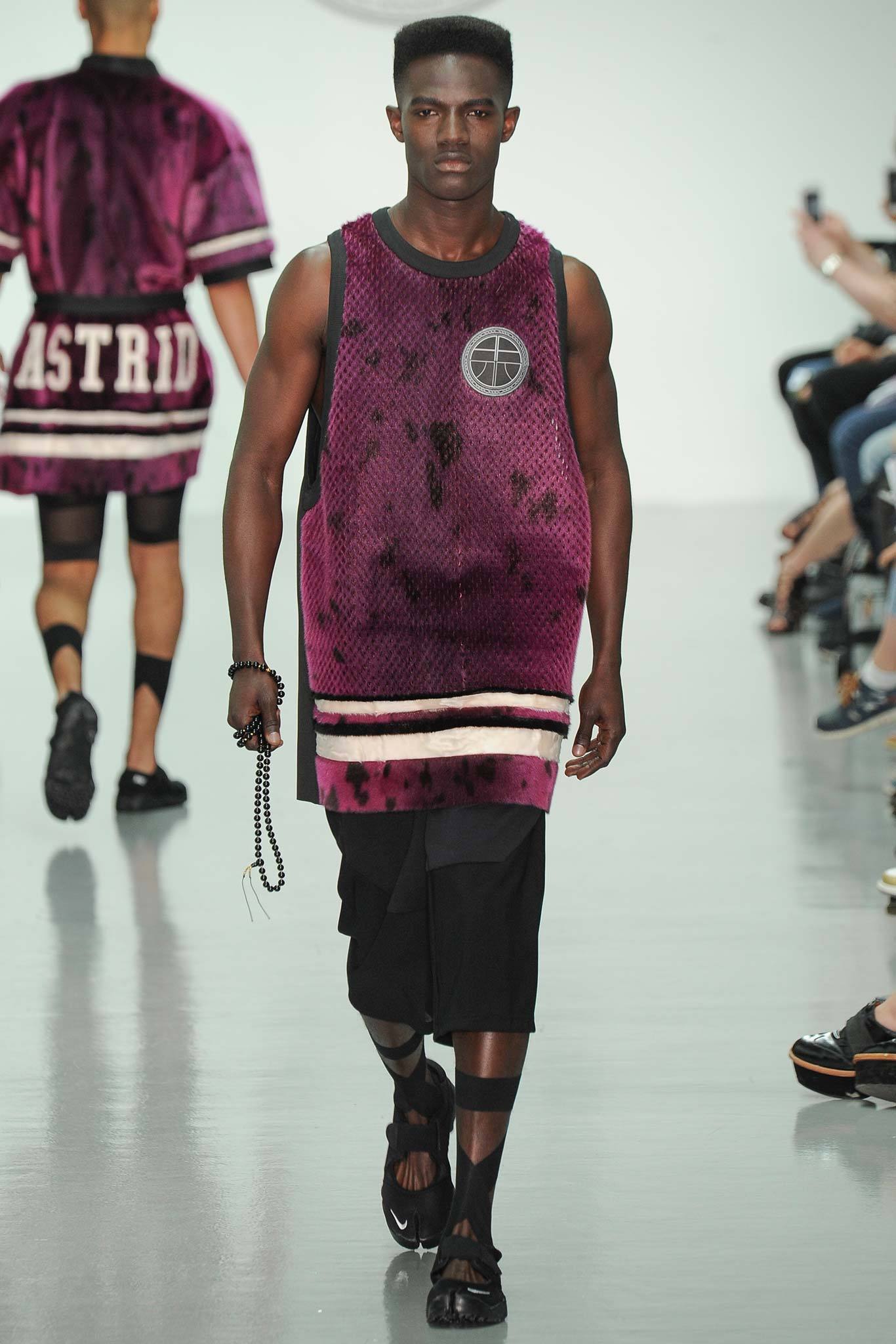 purple tank-top and black shorts