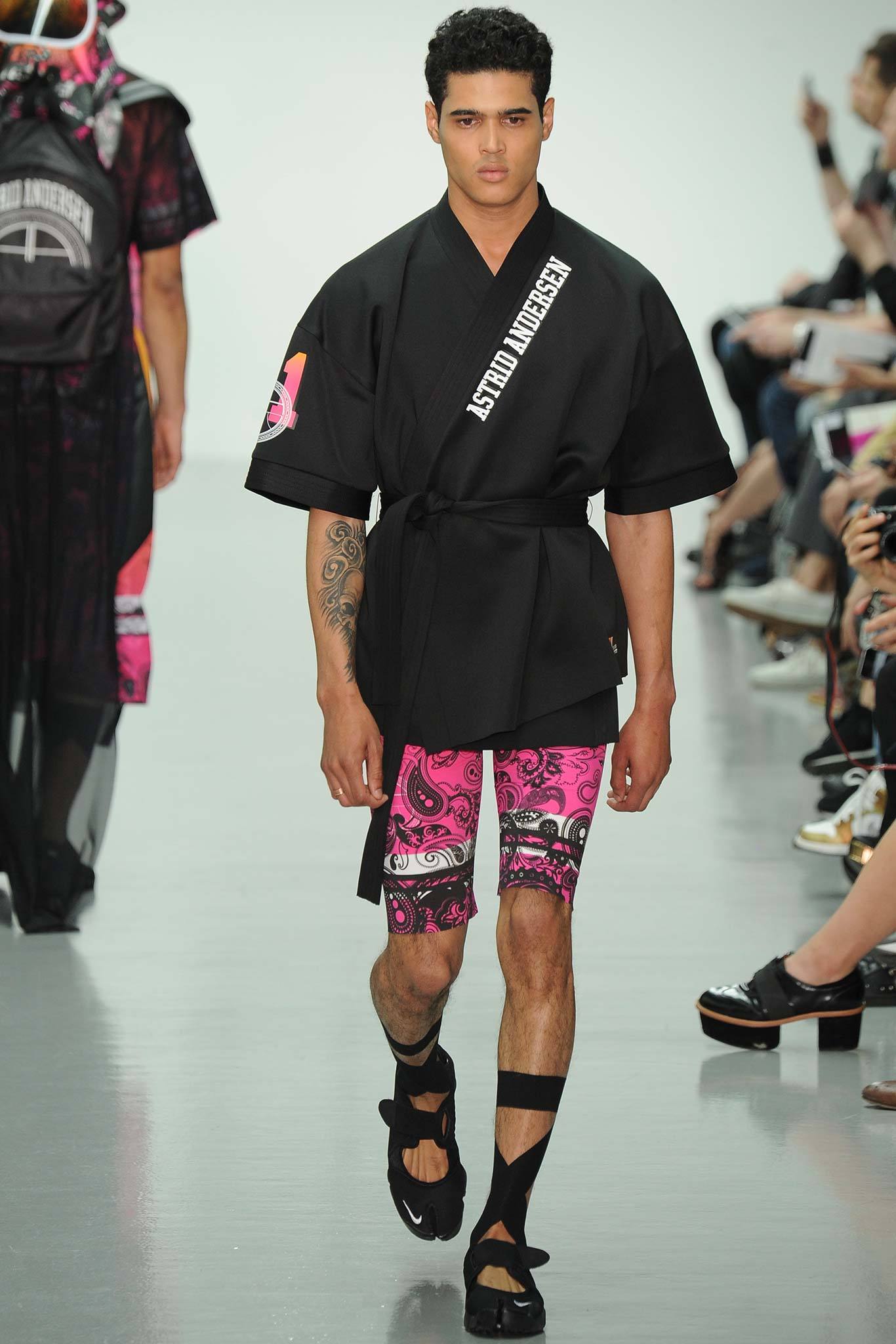 black relaxed top with pink shorts