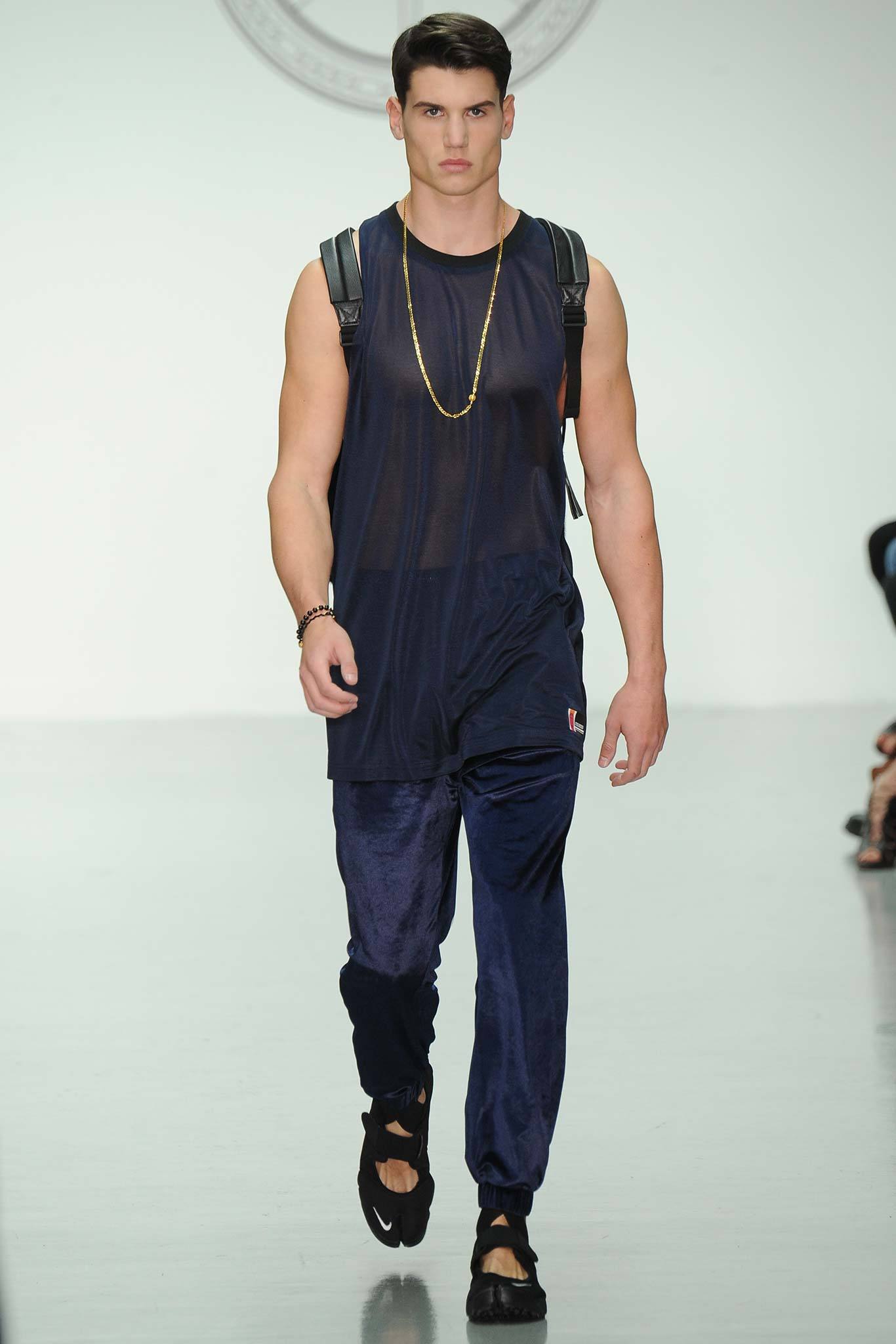 black mesh tank-top and navy velvet pants