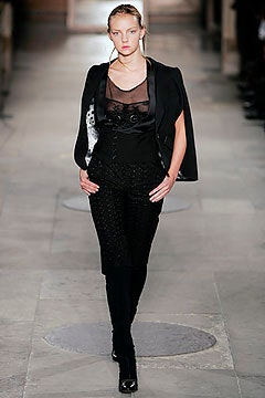 black fitted blazer and sheer top