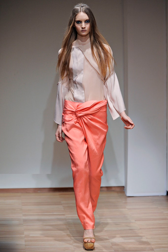 beige silk blouse with coral pants