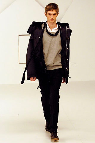 black jacket gray sweater black pants