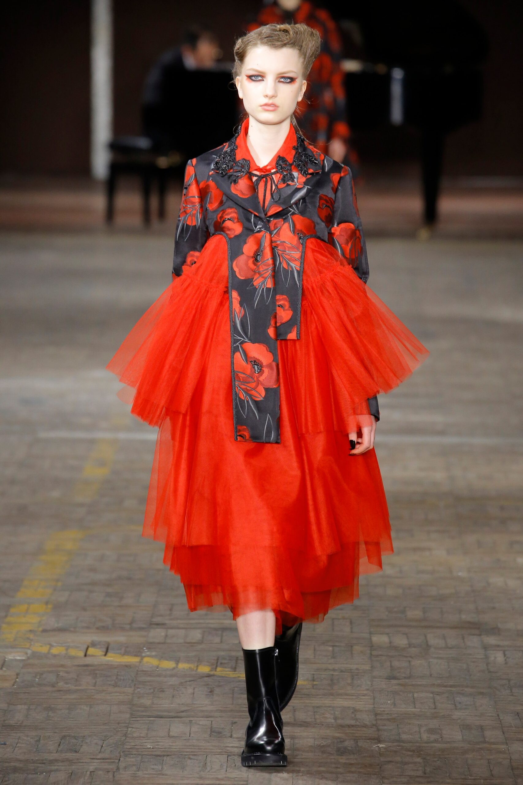 red tiered dress with black jacket