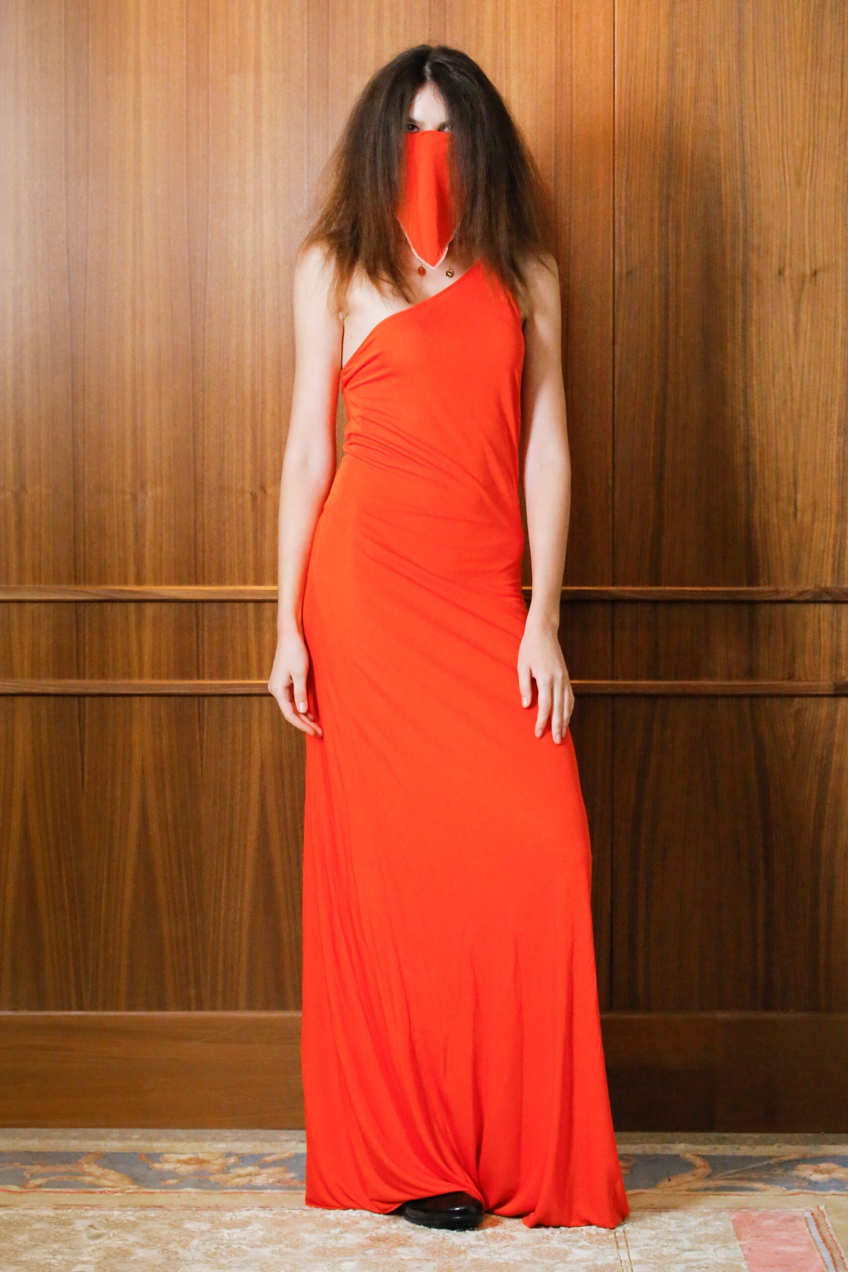 red fitted gown with mask