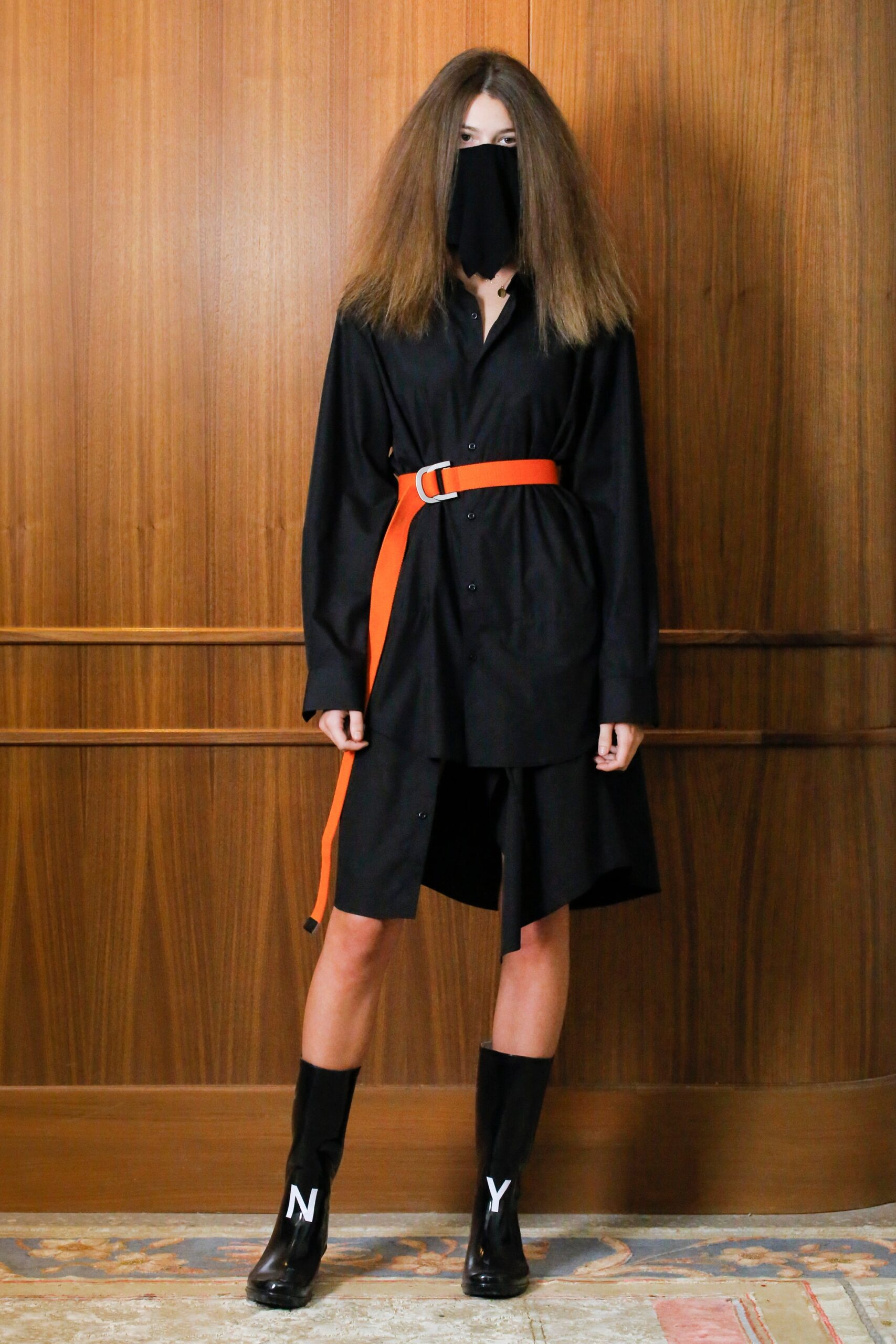 black shirt-dress with orange belt