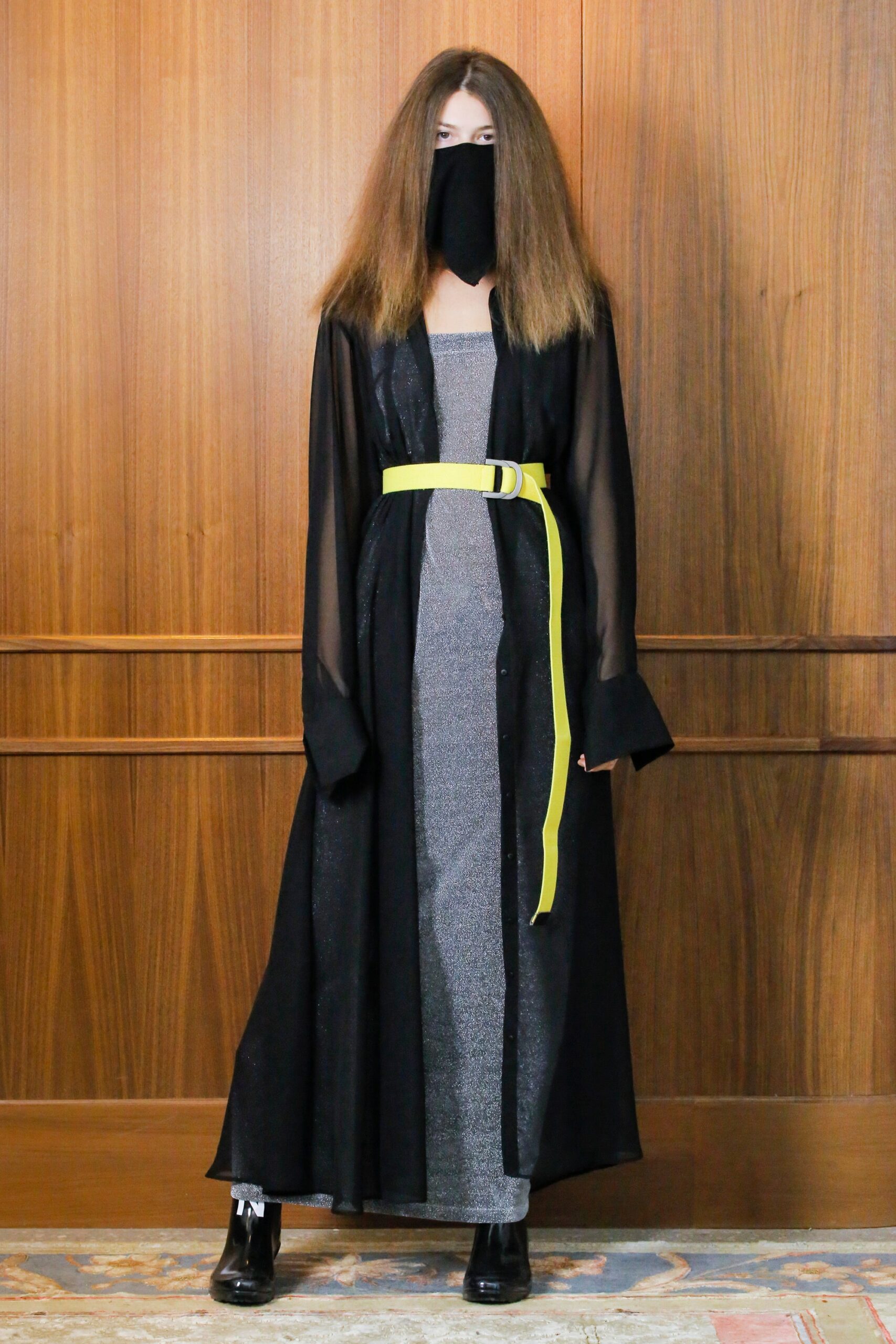 gray silk fitted maxi dress with black coat