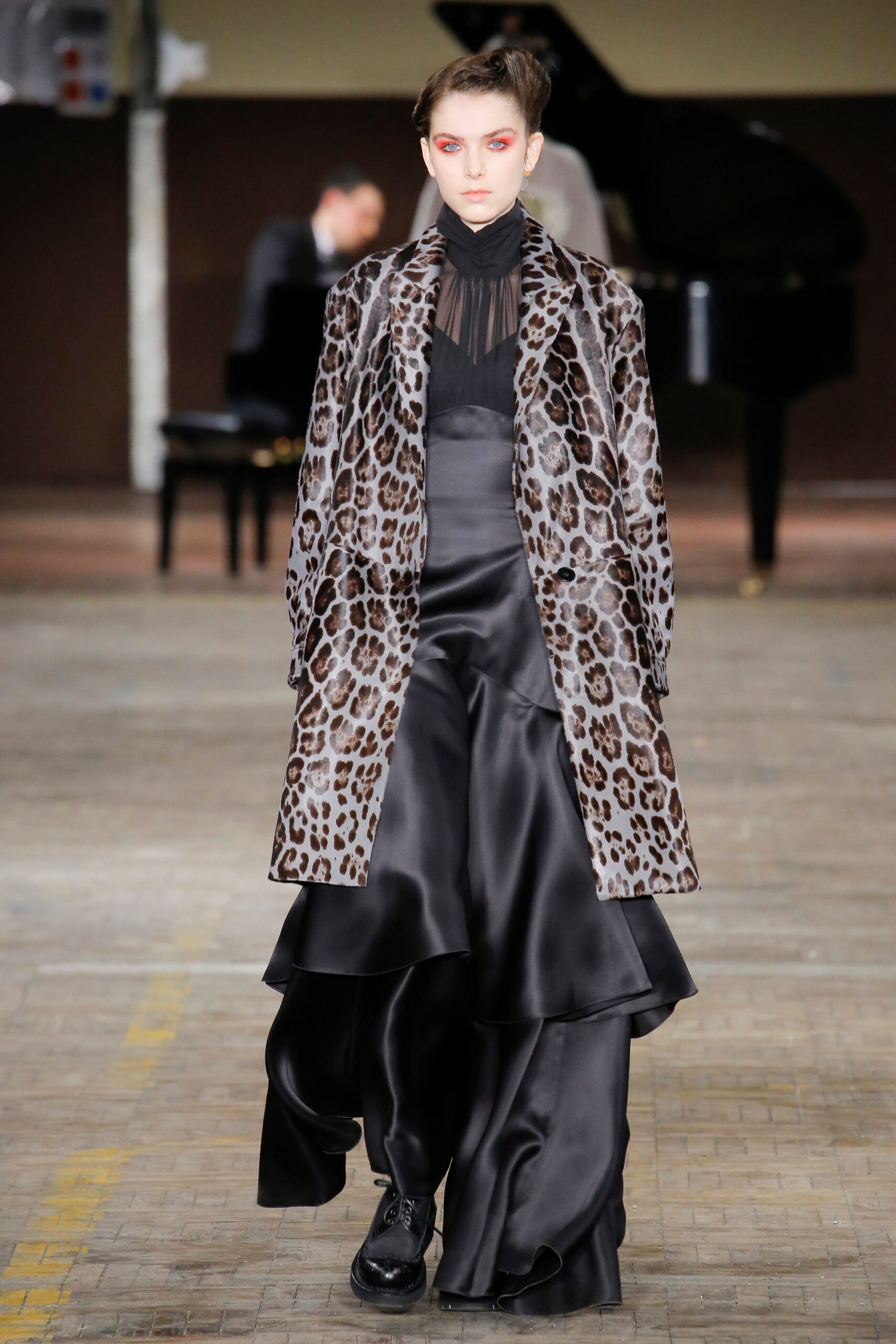 brown animal-print fur coat and black silk dress
