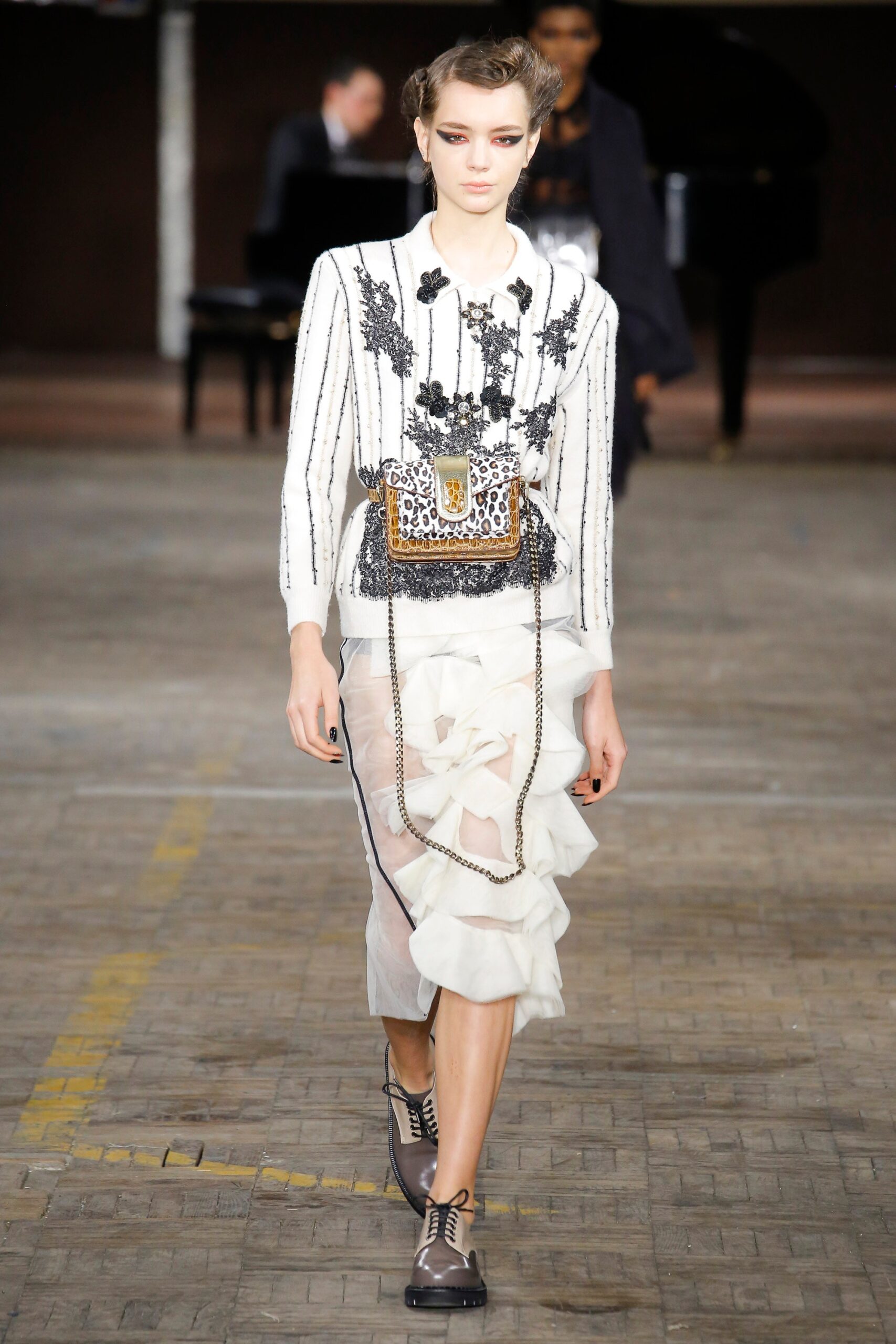white silk blouse with embroidered details