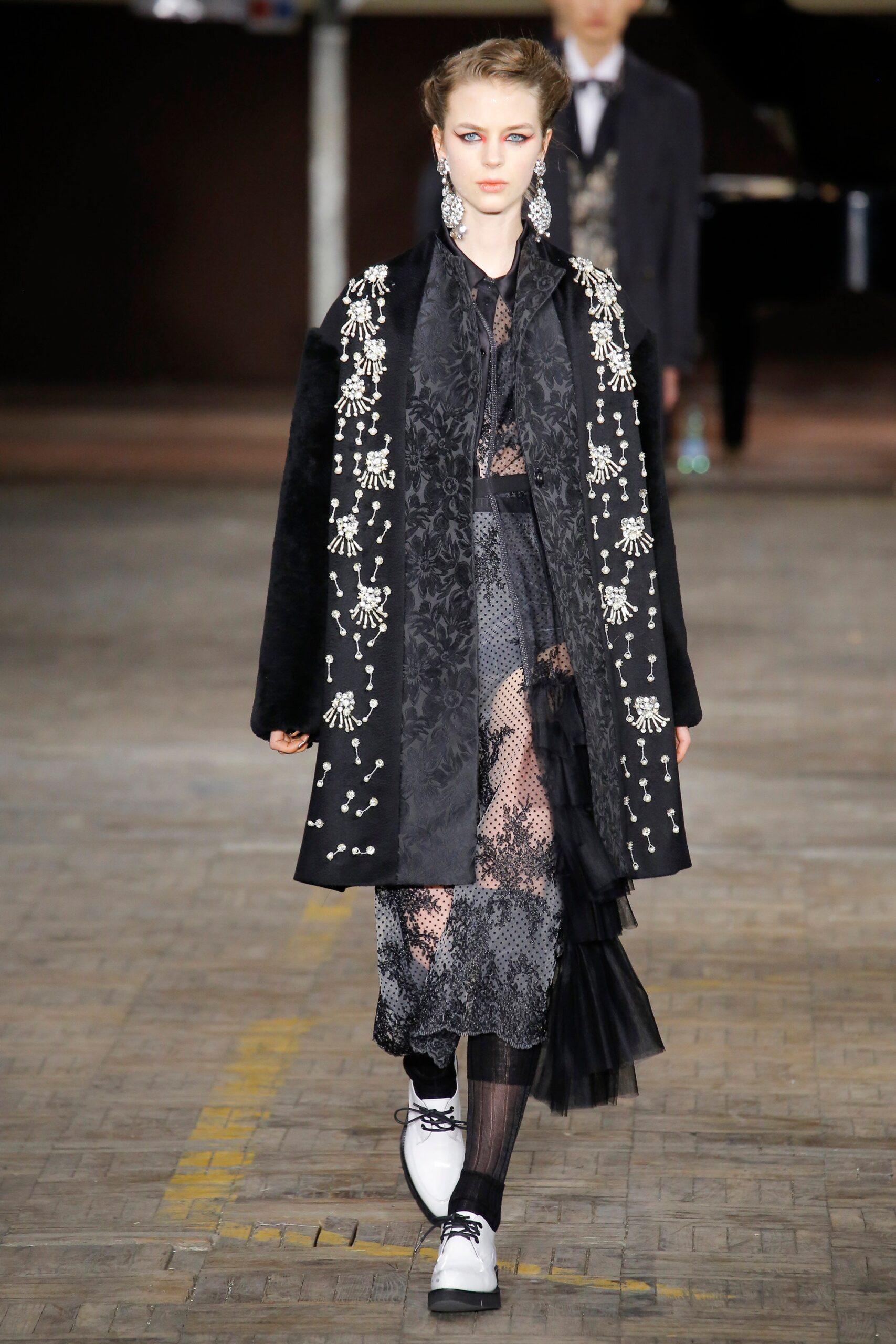 black faux-fur coat and lace dress